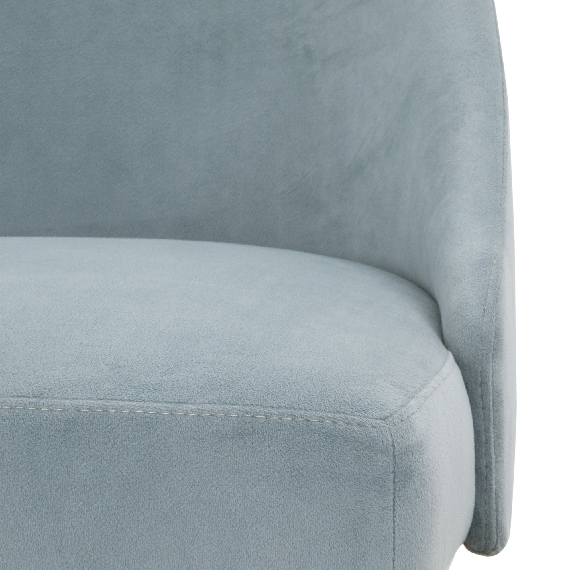 Close-up of light blue upholstered dining chair seat and curved backrest with soft suede texture