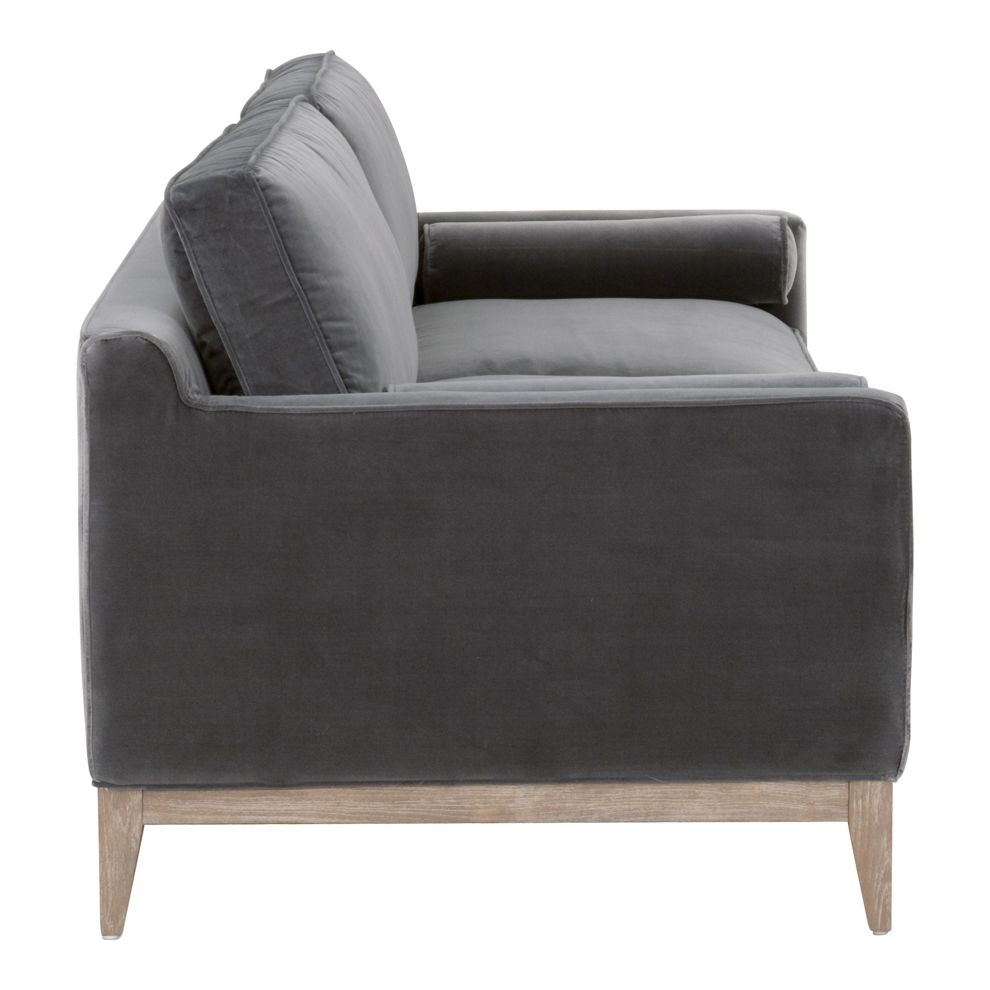 Side view of Essentials For Living Parker 86 sofa with gray velvet upholstery and natural oak legs