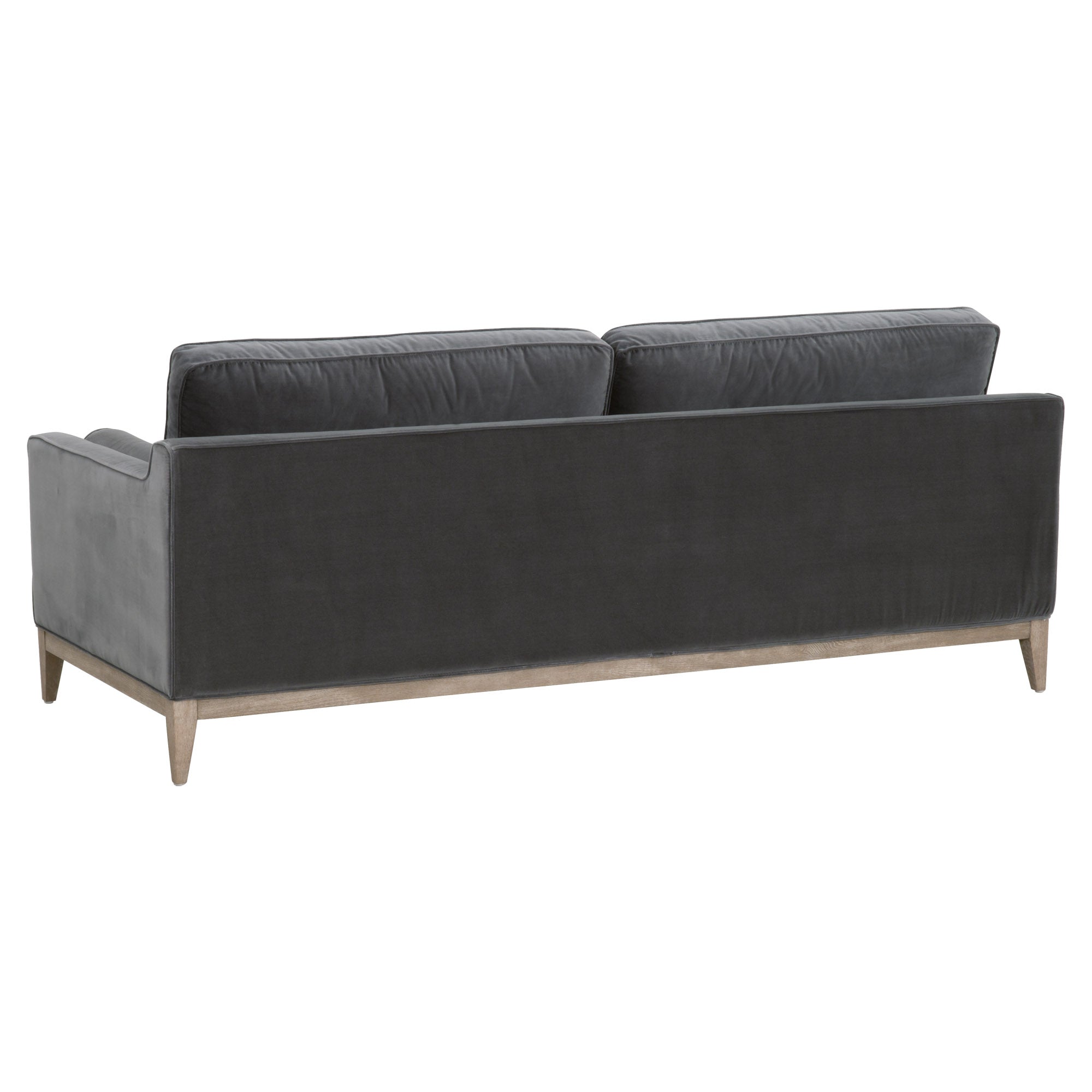 Essentials For Living Parker sofa in dark gray velvet with natural wood base, showcasing clean post-modern design.