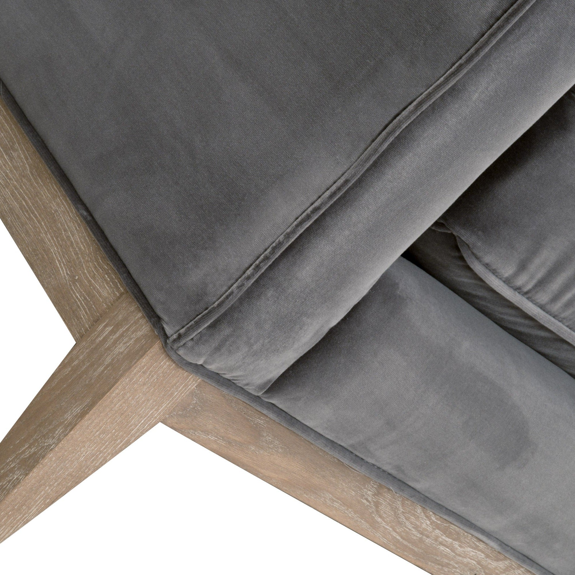 Close-up of Parker 86 sofa corner showing natural gray oak frame and soft gray velvet upholstery by Essentials For Living