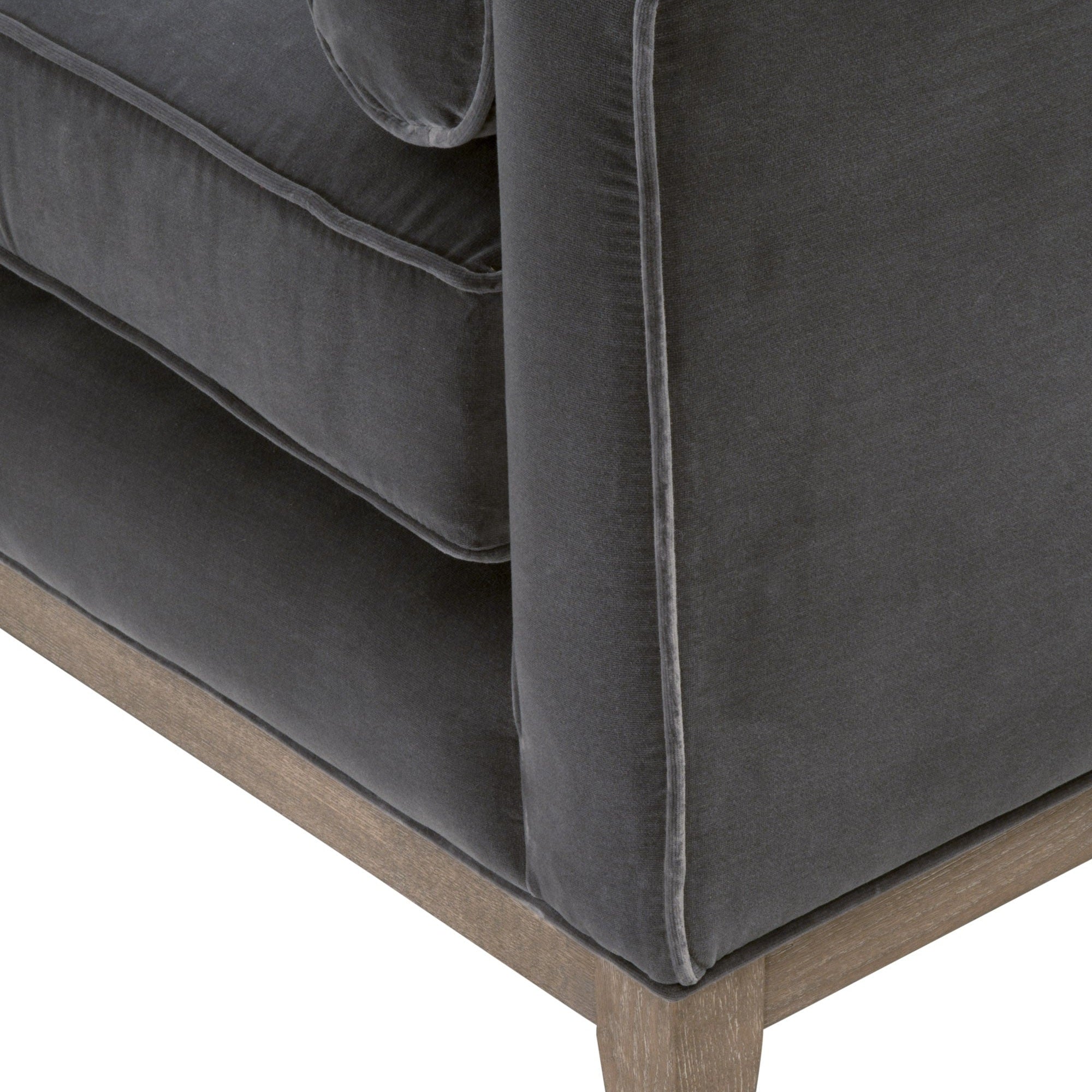 Close-up of Parker Post Modern Sofa Chair showing plush olive velvet upholstery and natural gray oak base by Essentials For Living