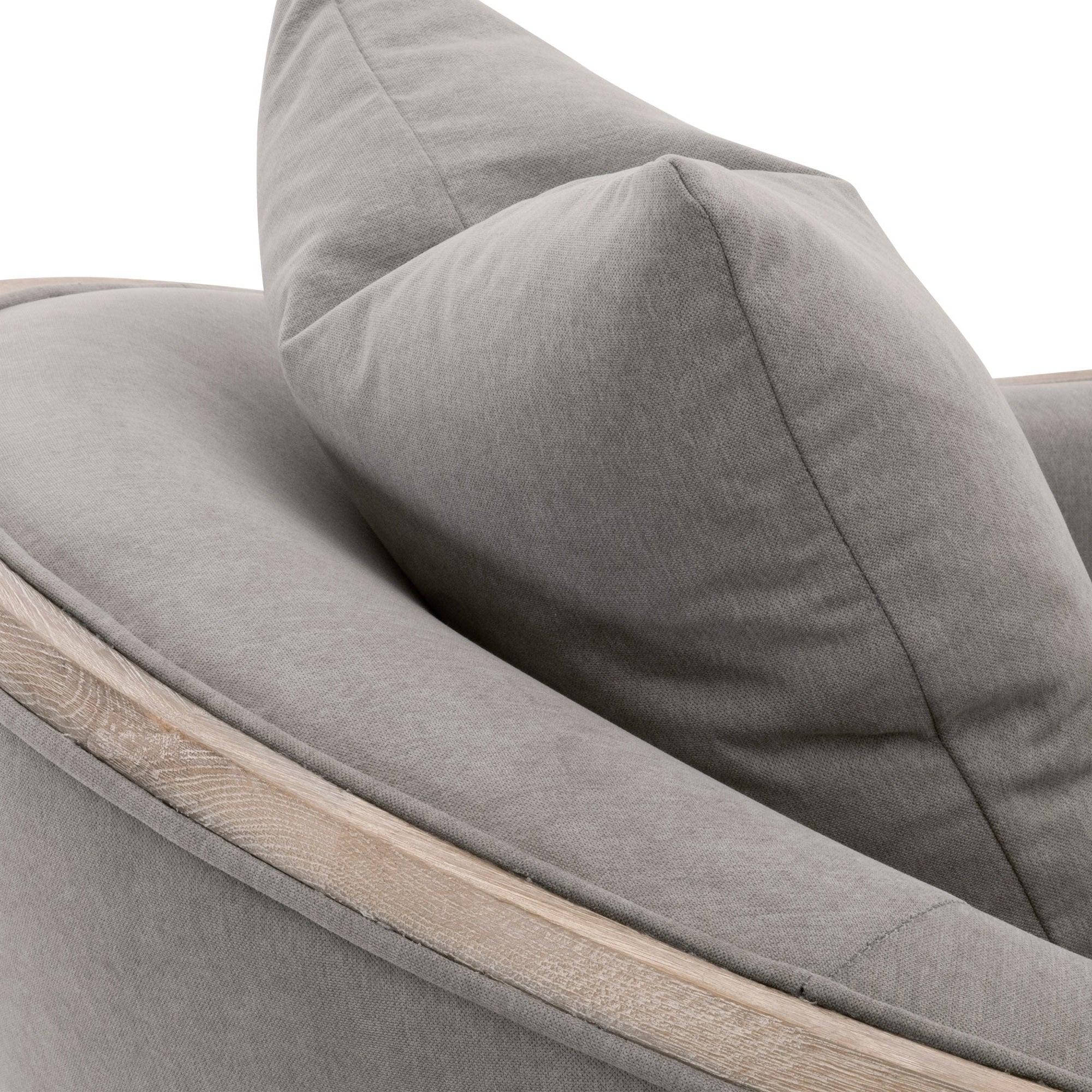 Close-up of gray LiveSmart fabric and natural oak trim on Paxton Swivel Club Chair by Essentials For Living