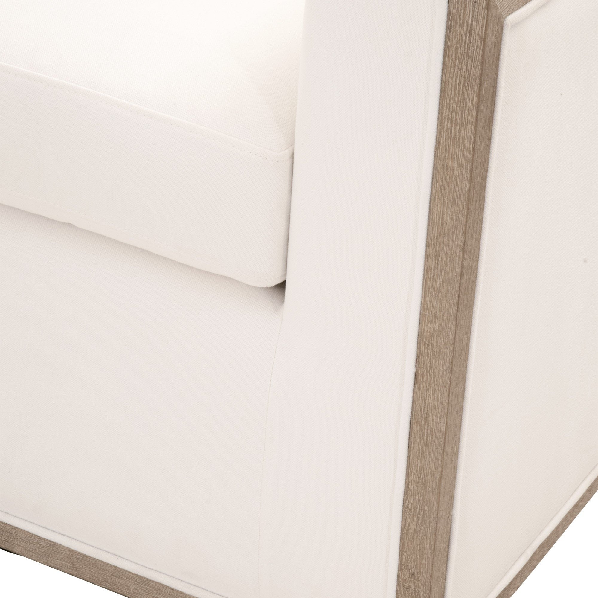 Close-up of Paxton Swivel Club Chair’s white upholstery and natural gray oak trim by Essentials For Living