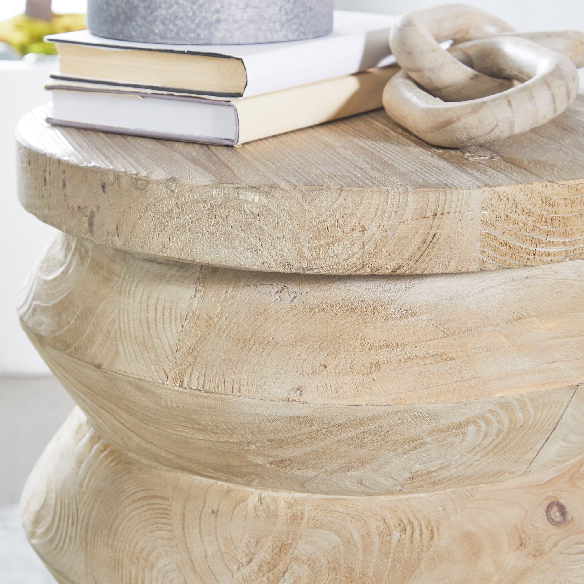 Close-up of a solid reclaimed pine Pier Accent Table with books and decorative item on top by Essentials For Living