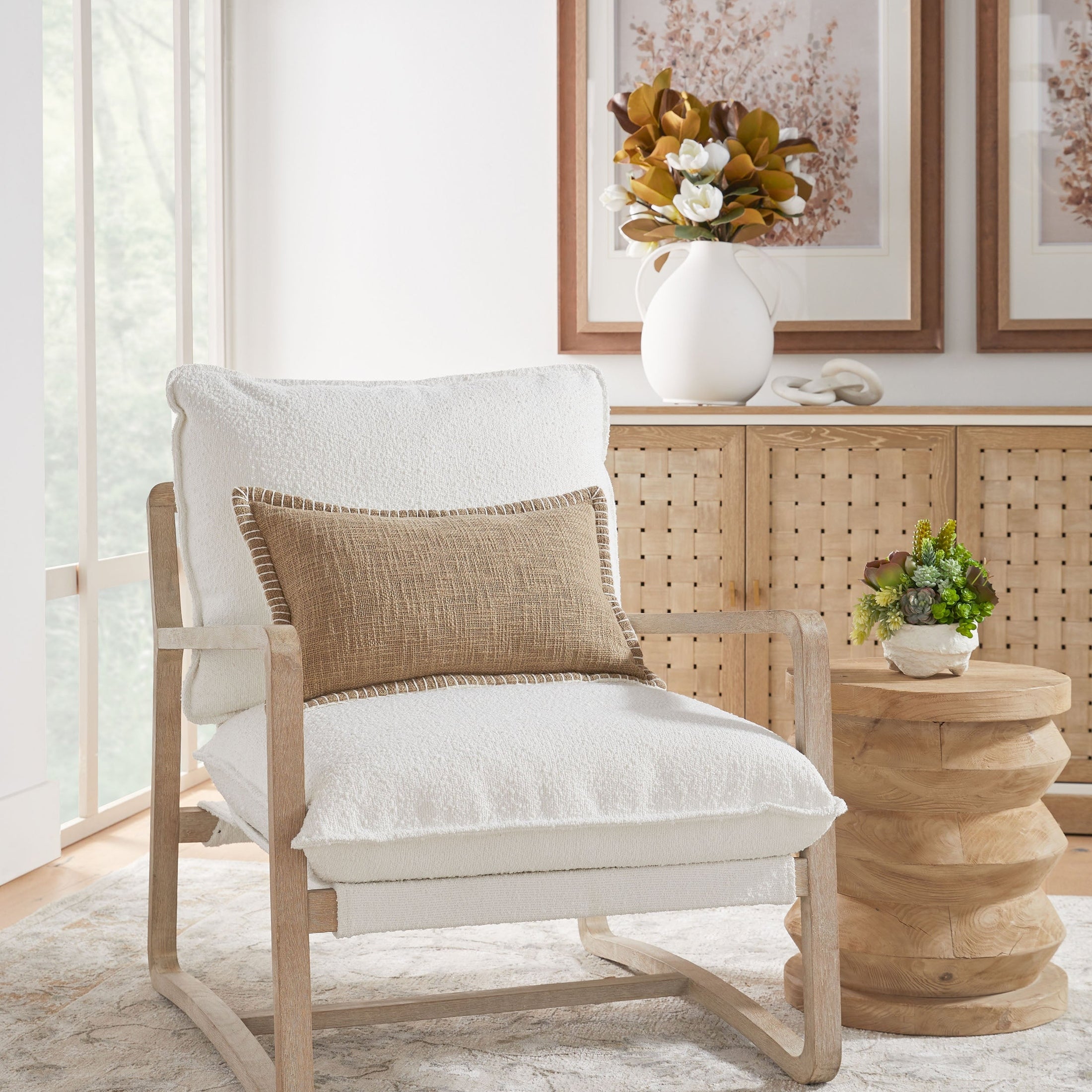 Essentials for Living Pier Accent Table in reclaimed pine with smoke gray finish beside cushioned chair in cozy room