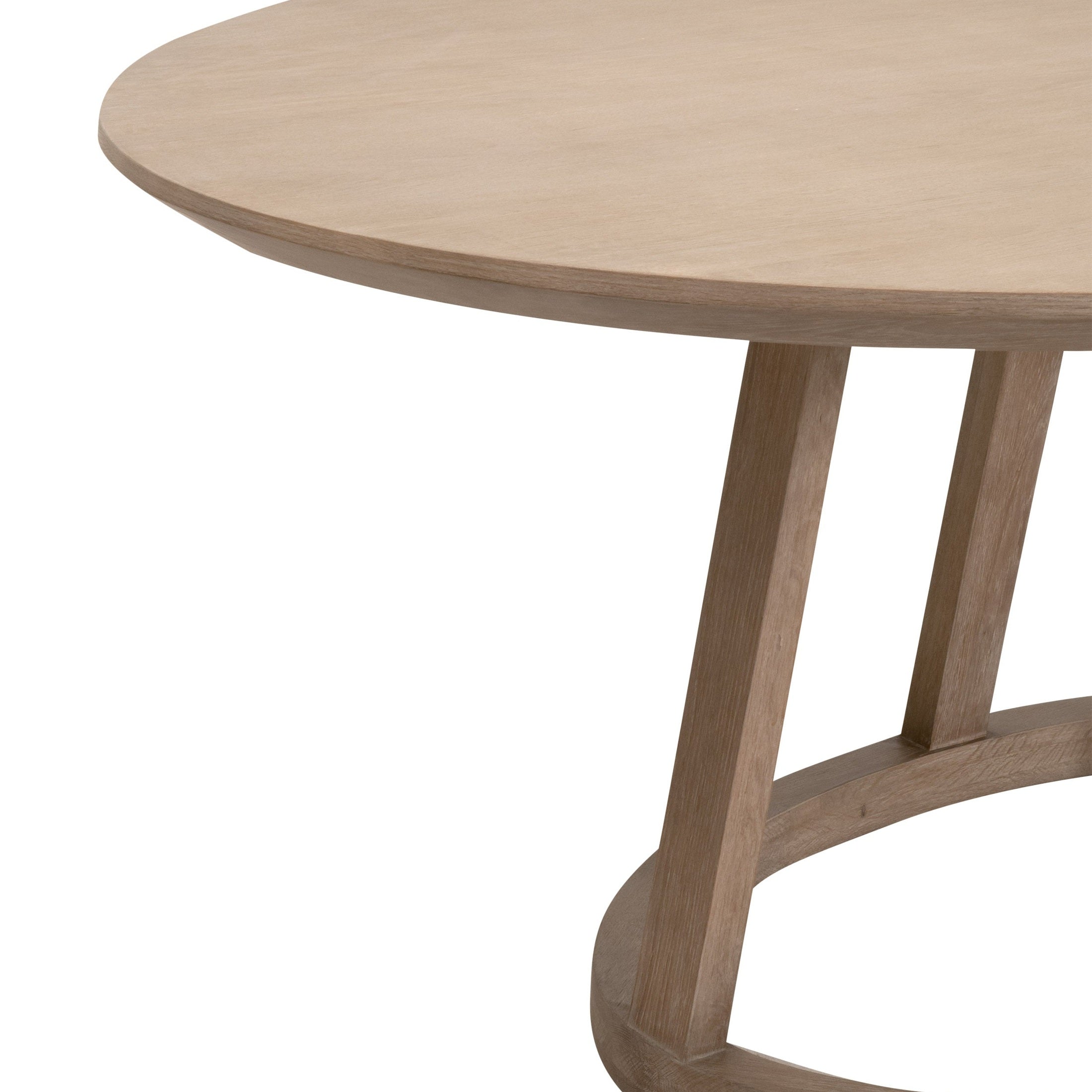 Close-up of Reeves Oval Dining Table with natural wood grain and pedestal base by Essentials for Living