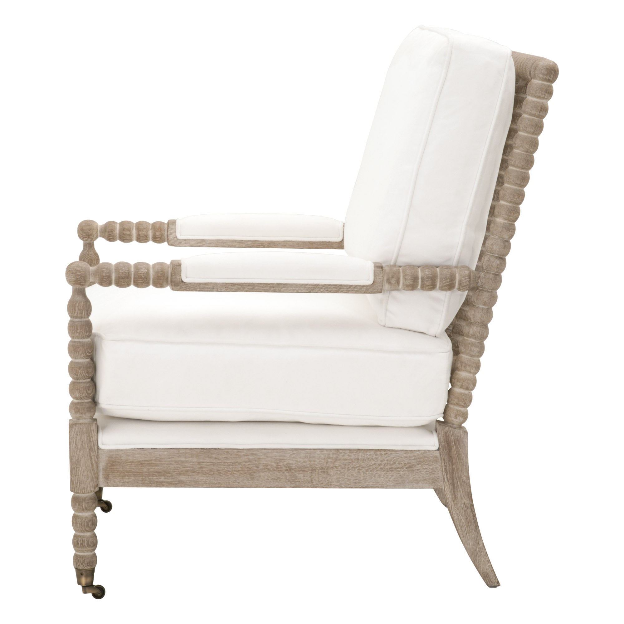 Side view of Rouleau Club Chair with carved gray oak frame and white upholstered cushions by Essentials For Living