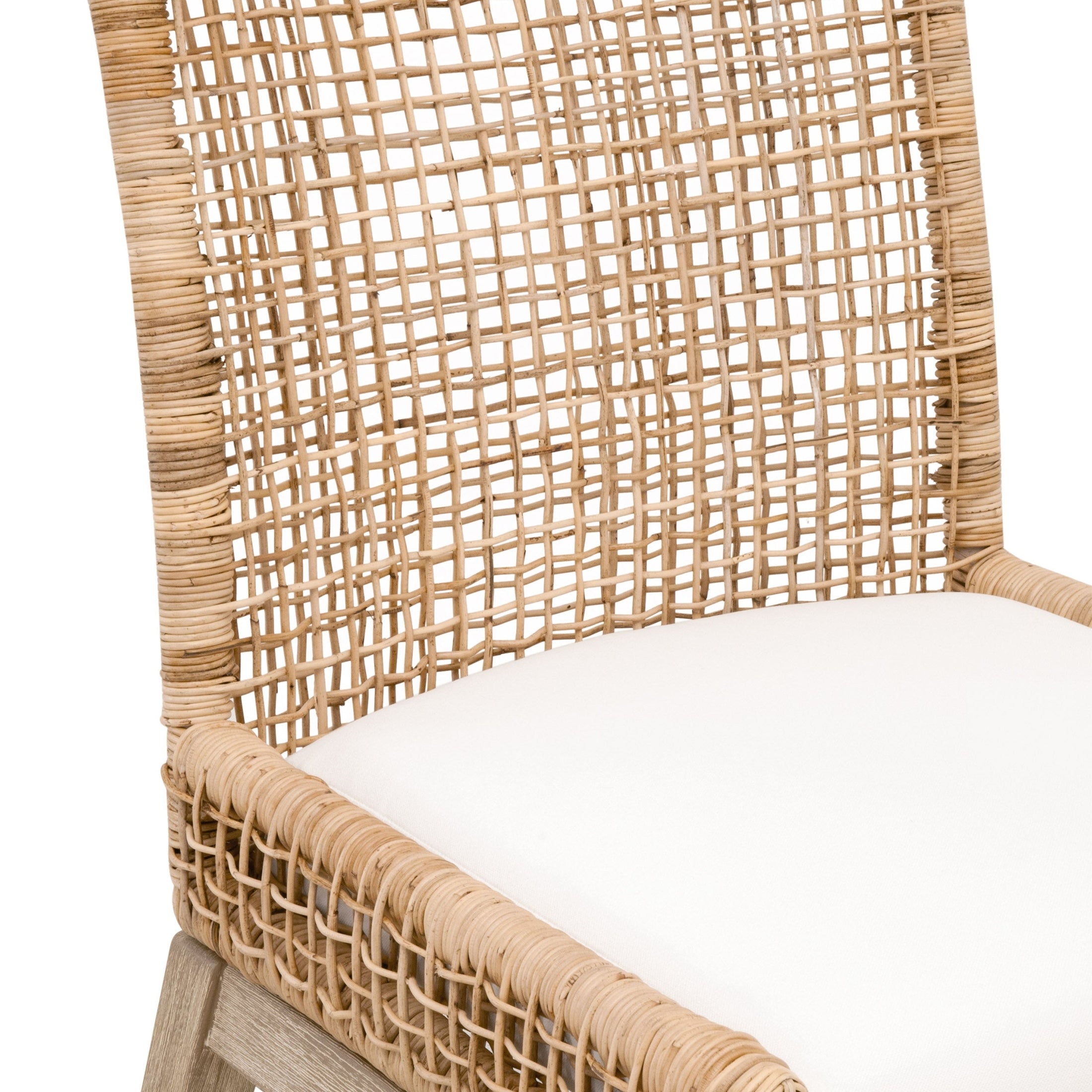 Close-up of Essentials for Living Seaside Dining Chair with handwoven natural rattan back and white cushioned seat