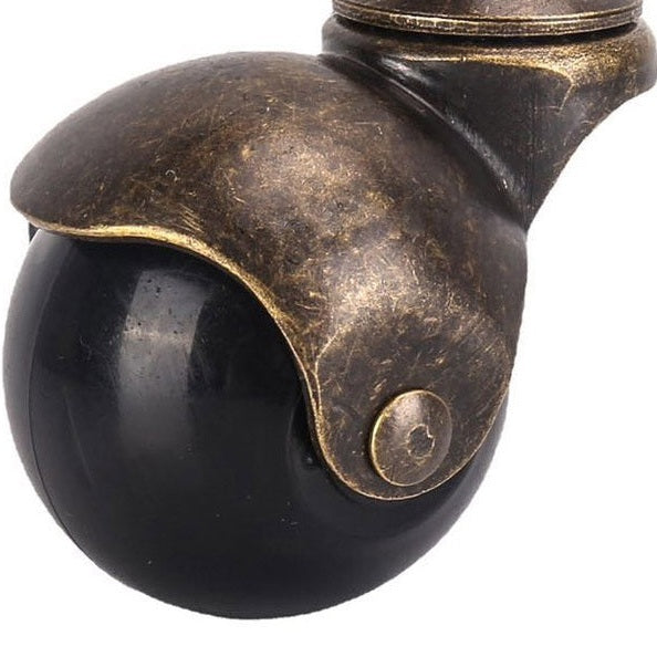 Close-up of vintage-style caster wheel with bronze finish for smooth chair mobility on hard floors or carpet