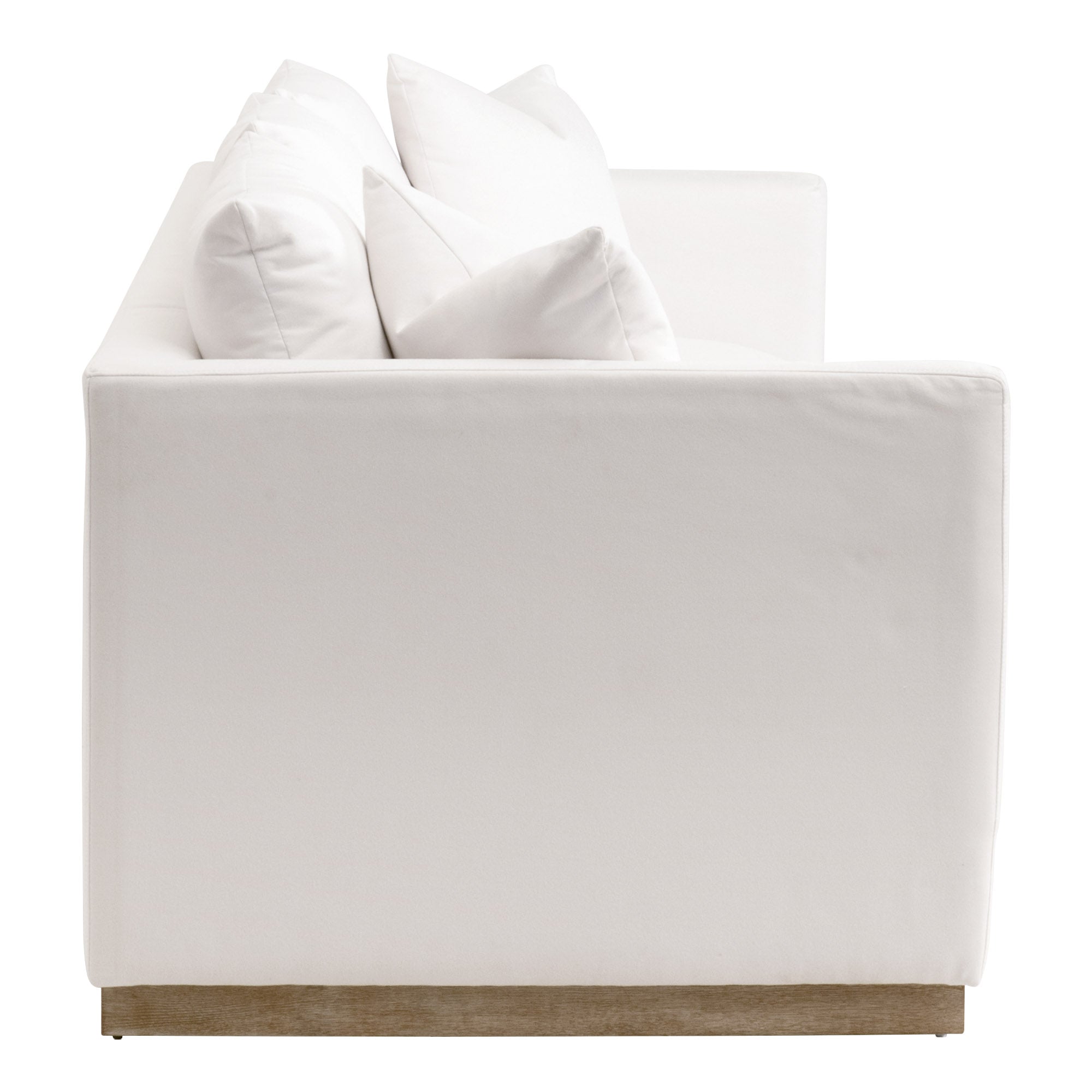 Side view of Essentials For Living Siena 96 plinth base sofa in ivory LiveSmart fabric with plush cushions and wood base