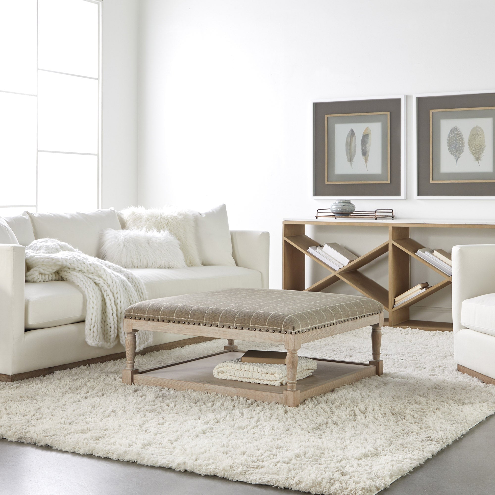 Ivory Siena 96 Plinth Base Sofa by Essentials for Living in bright living room with cozy cushions and soft throw blanket