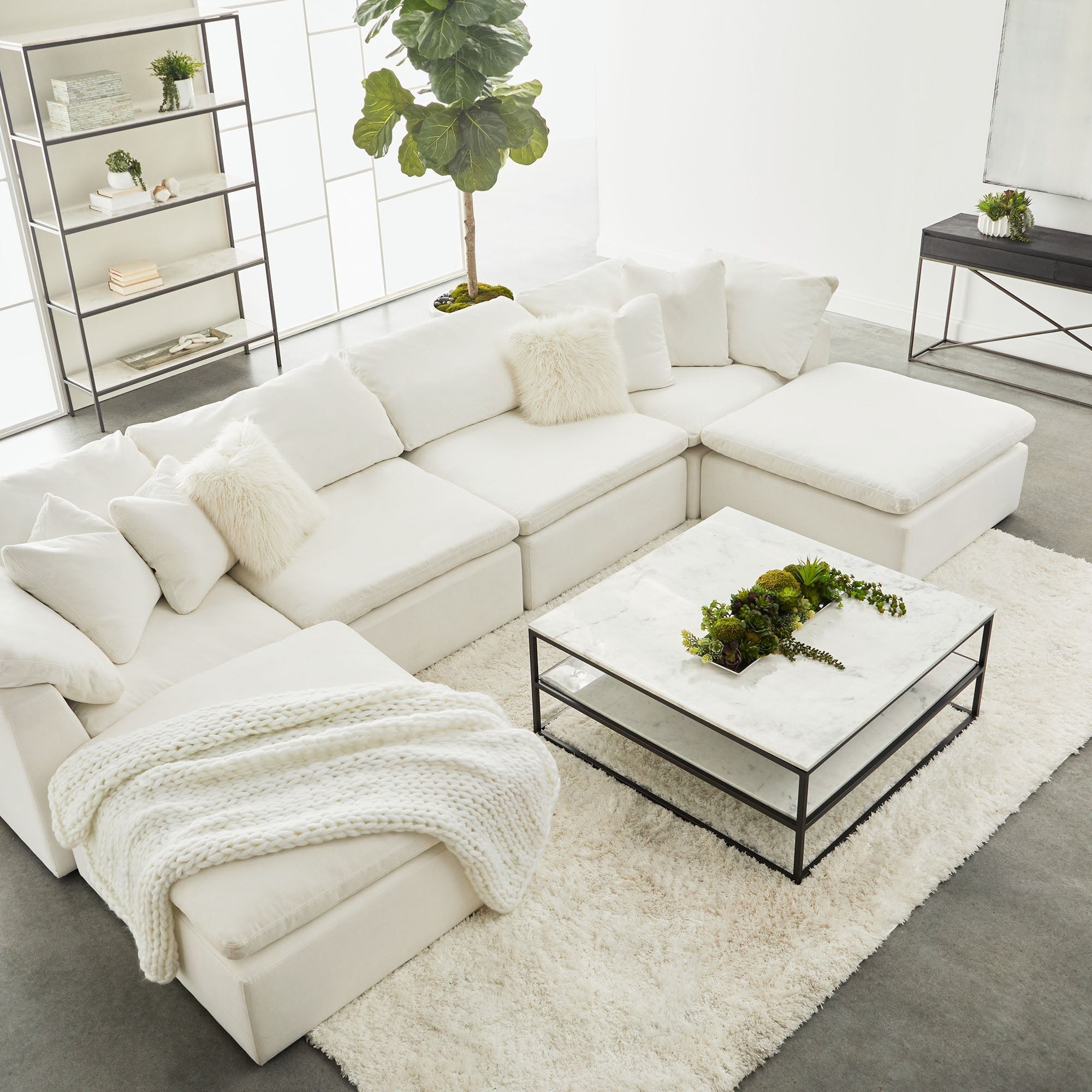 Essentials for Living Sky Modular Armless Chair in white Peyton-Pearl fabric with birch wood feet in a modern living room setup