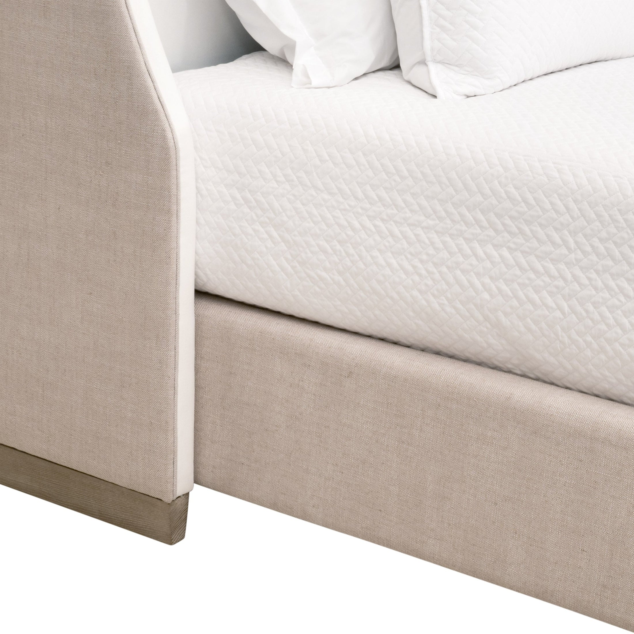 Close-up of Sloan Queen Bed corner showing bisque linen upholstery and natural gray oak leg by Essentials For Living