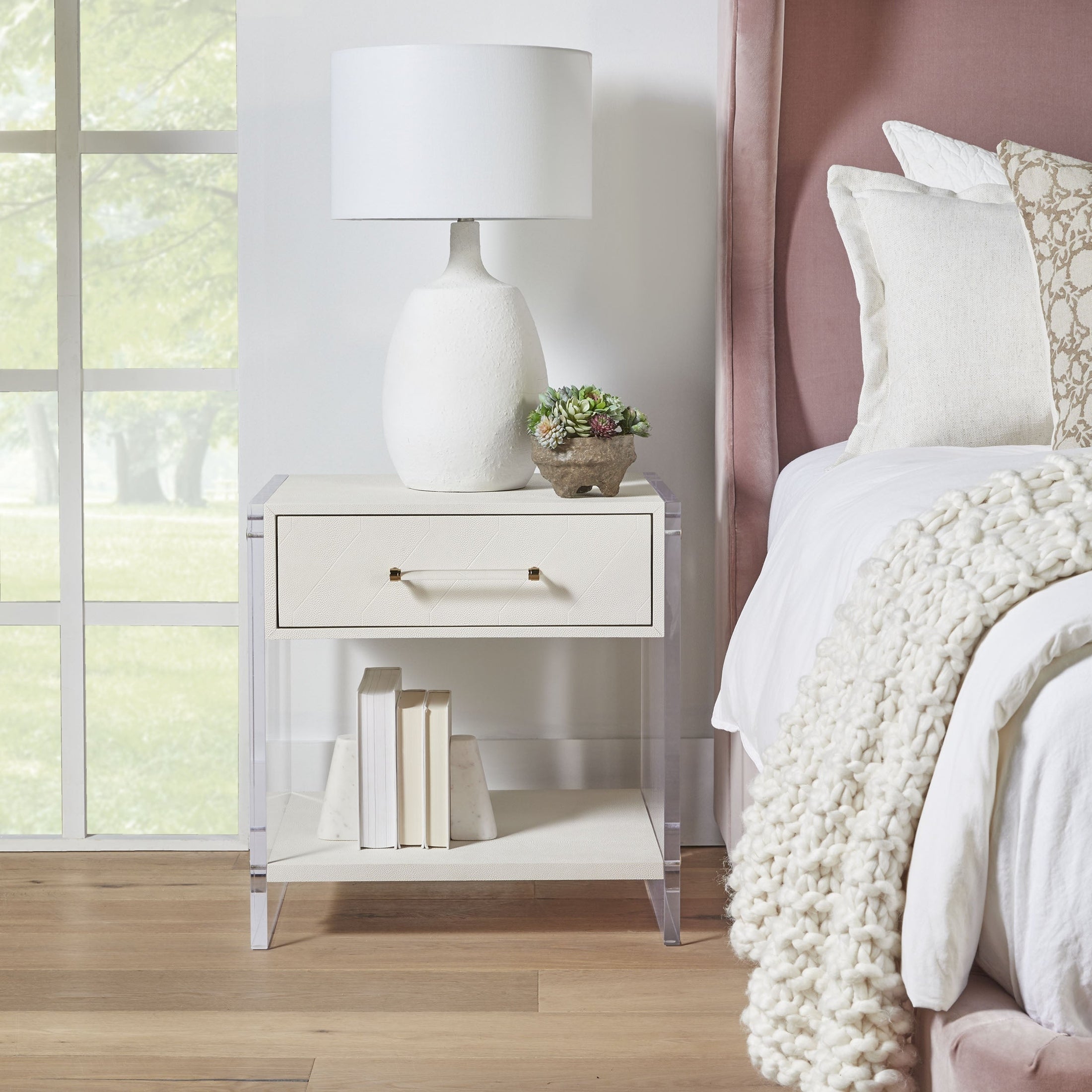 Pearl-white Sonia Shagreen nightstand with acrylic legs, brass hardware, drawer, and lower shelf by Essentials for Living