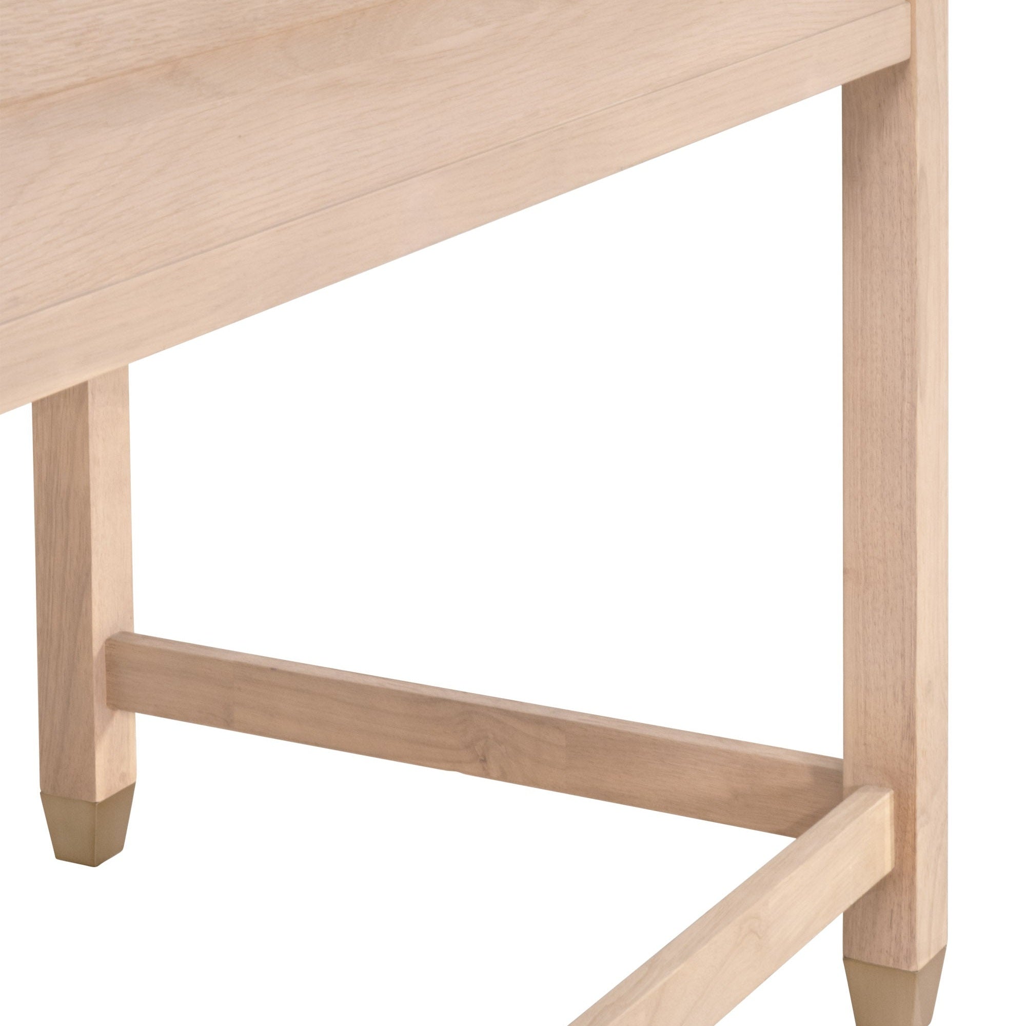 Close-up of solid rubberwood legs with brushed brass feet on the Essentials For Living Stella Desk