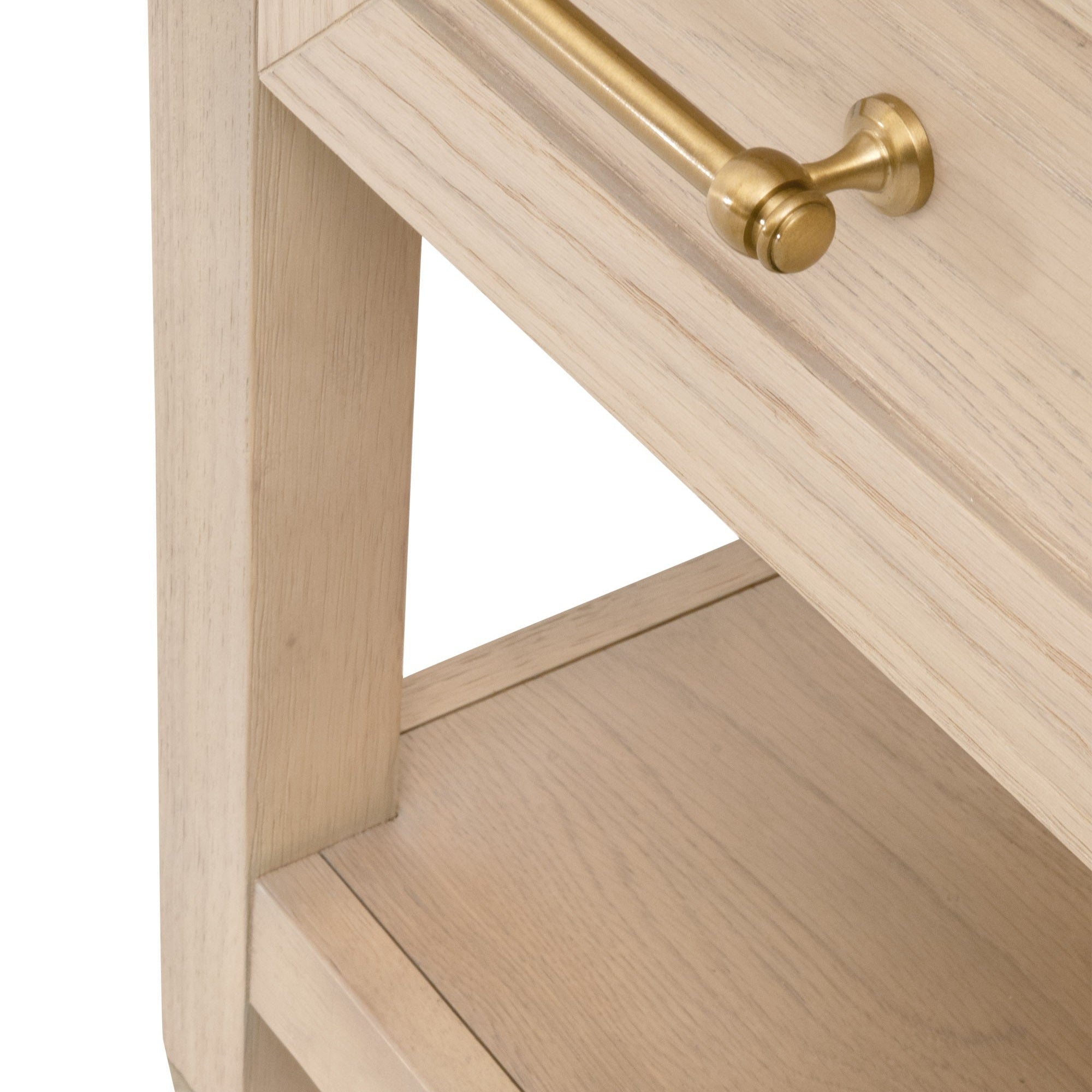 Close-up of light wood Stella nightstand drawer with brass handle and lower storage shelf by Essentials For Living