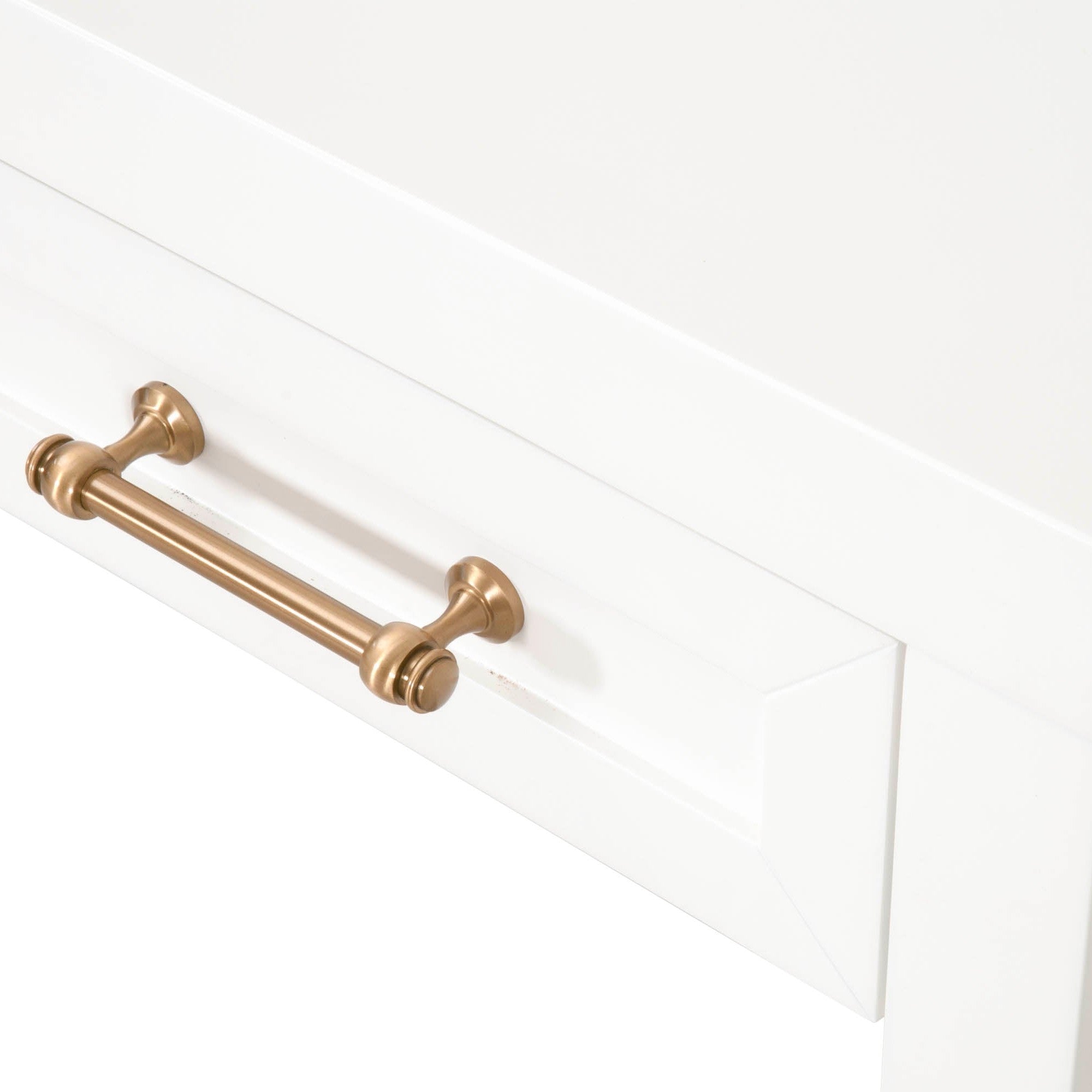 Close-up of brushed brass handle on matte white lacquer drawer of Essentials for Living Stella Desk