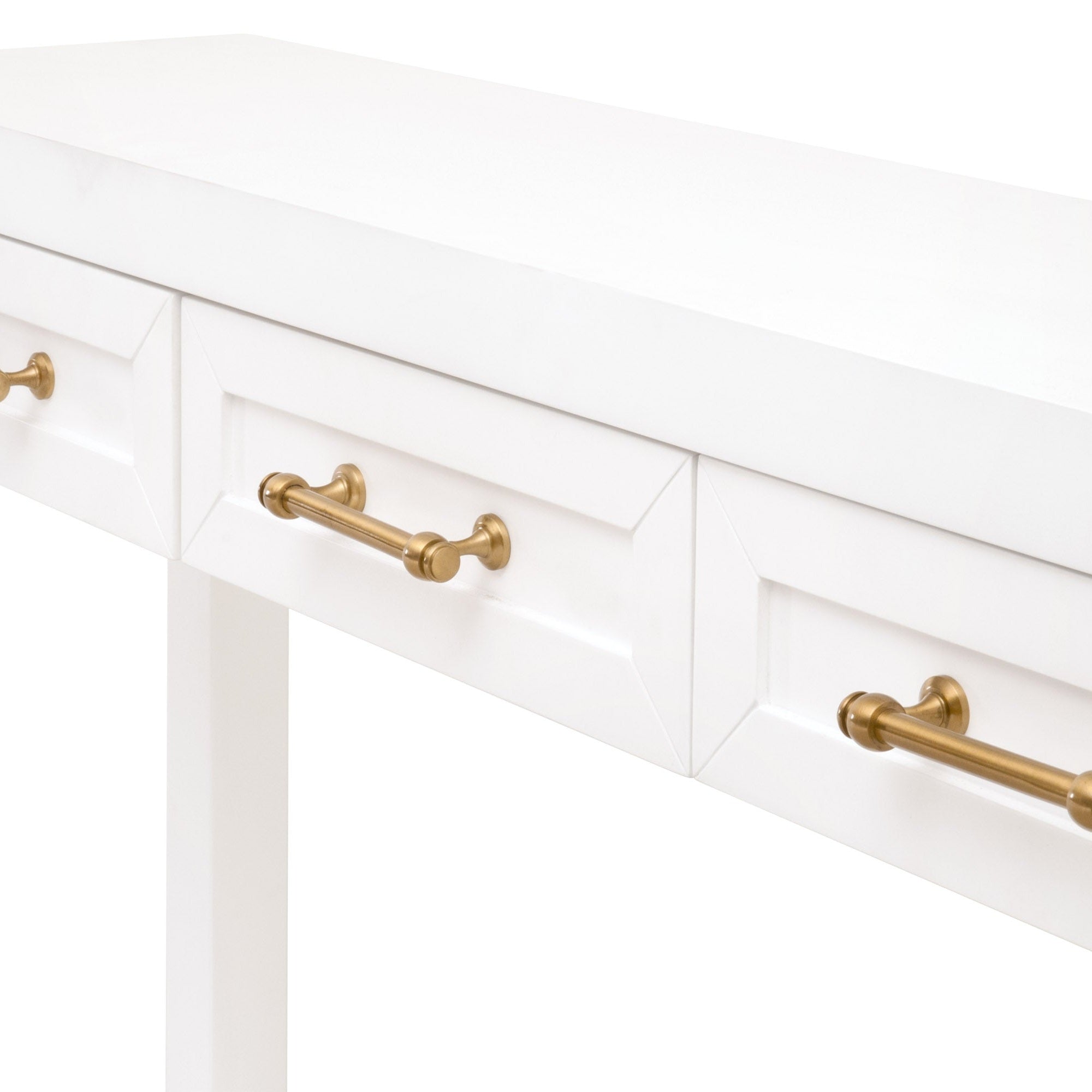 Close-up of white console table drawers with elegant brushed brass handles in modern minimalist design