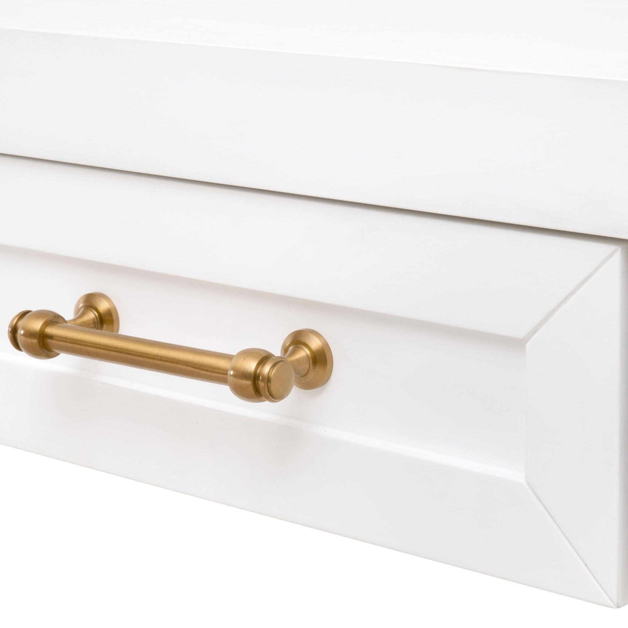 Close-up of brushed brass drawer handle on white Stella Narrow Console Table by Essentials for Living