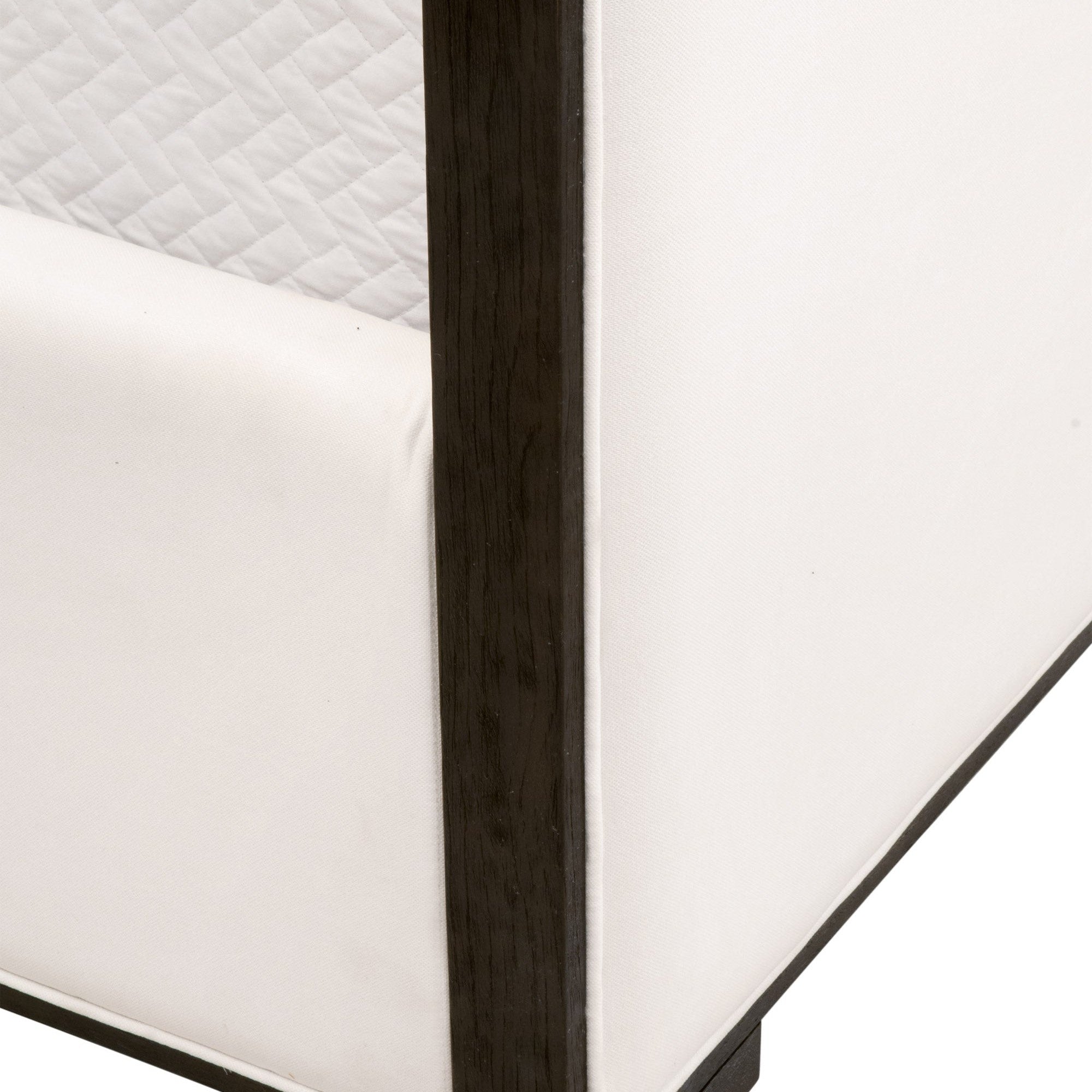 Close-up of Tailor Queen Bed corner featuring matte brown oak frame and soft Peyton-Pearl upholstery by Essentials for Living