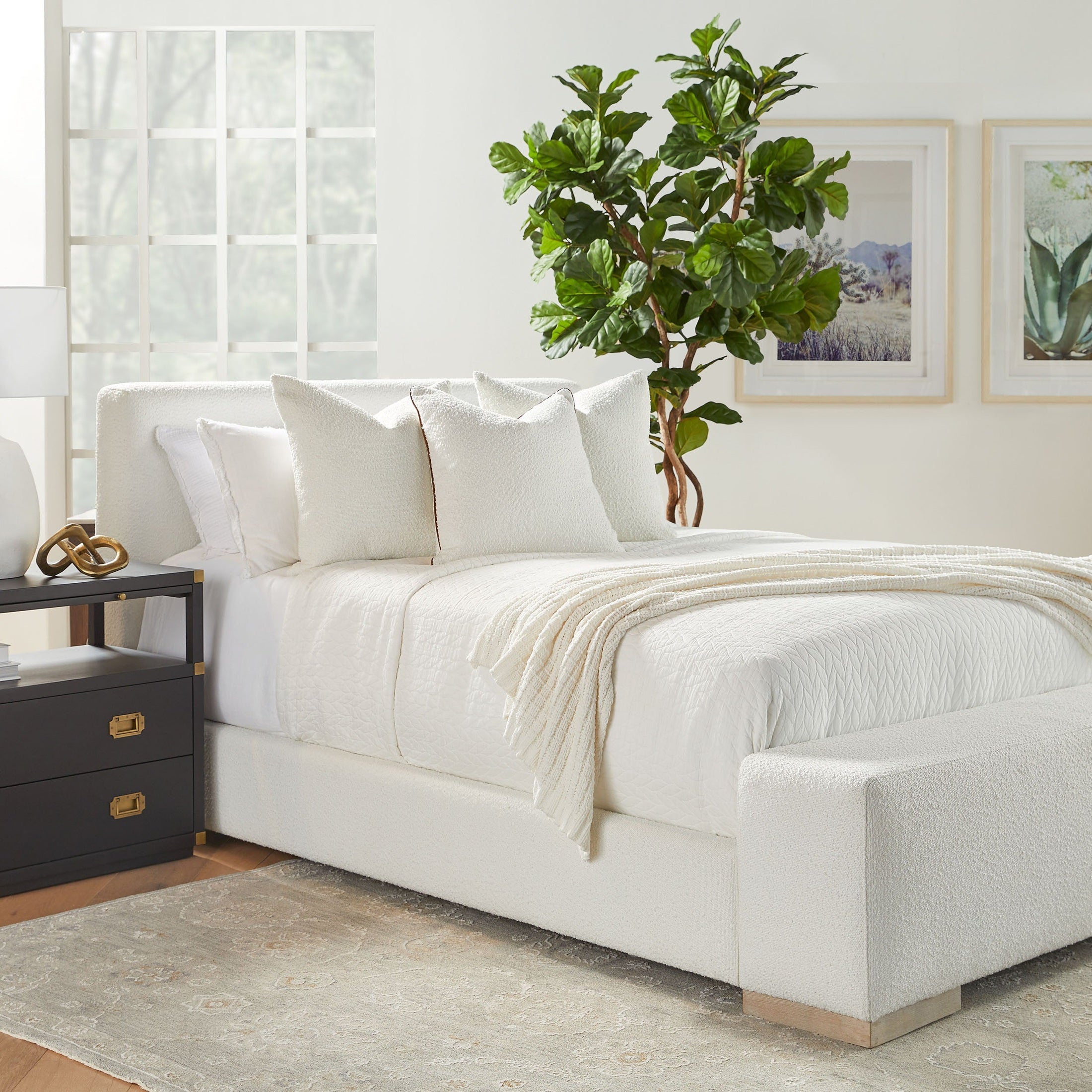 Warren Queen Bed by Essentials For Living in white boucle fabric with wide footboard and oak legs in bright bedroom setting