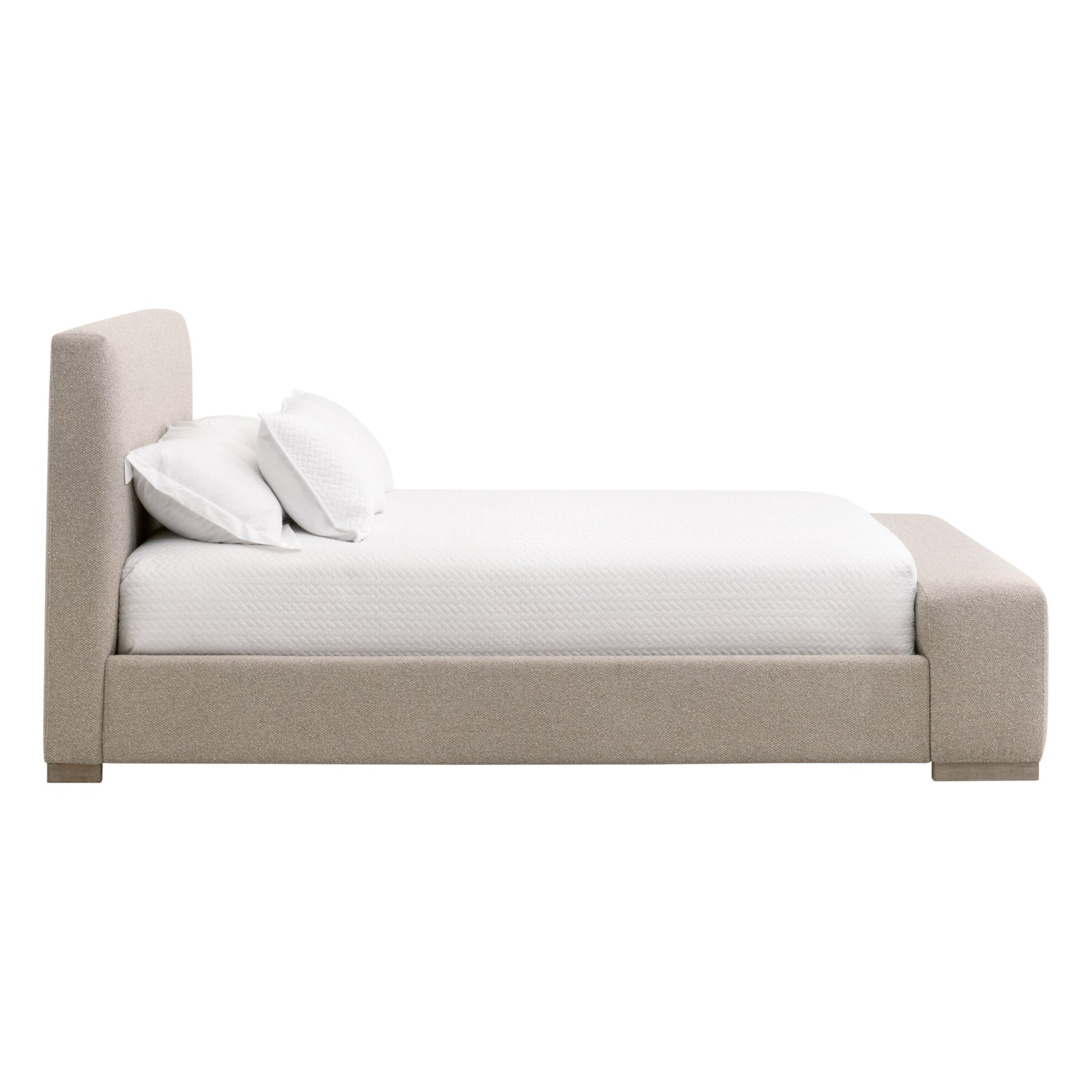Side view of a Warren Standard King Bed with upholstered frame and cushioned headboard by Essentials for Living