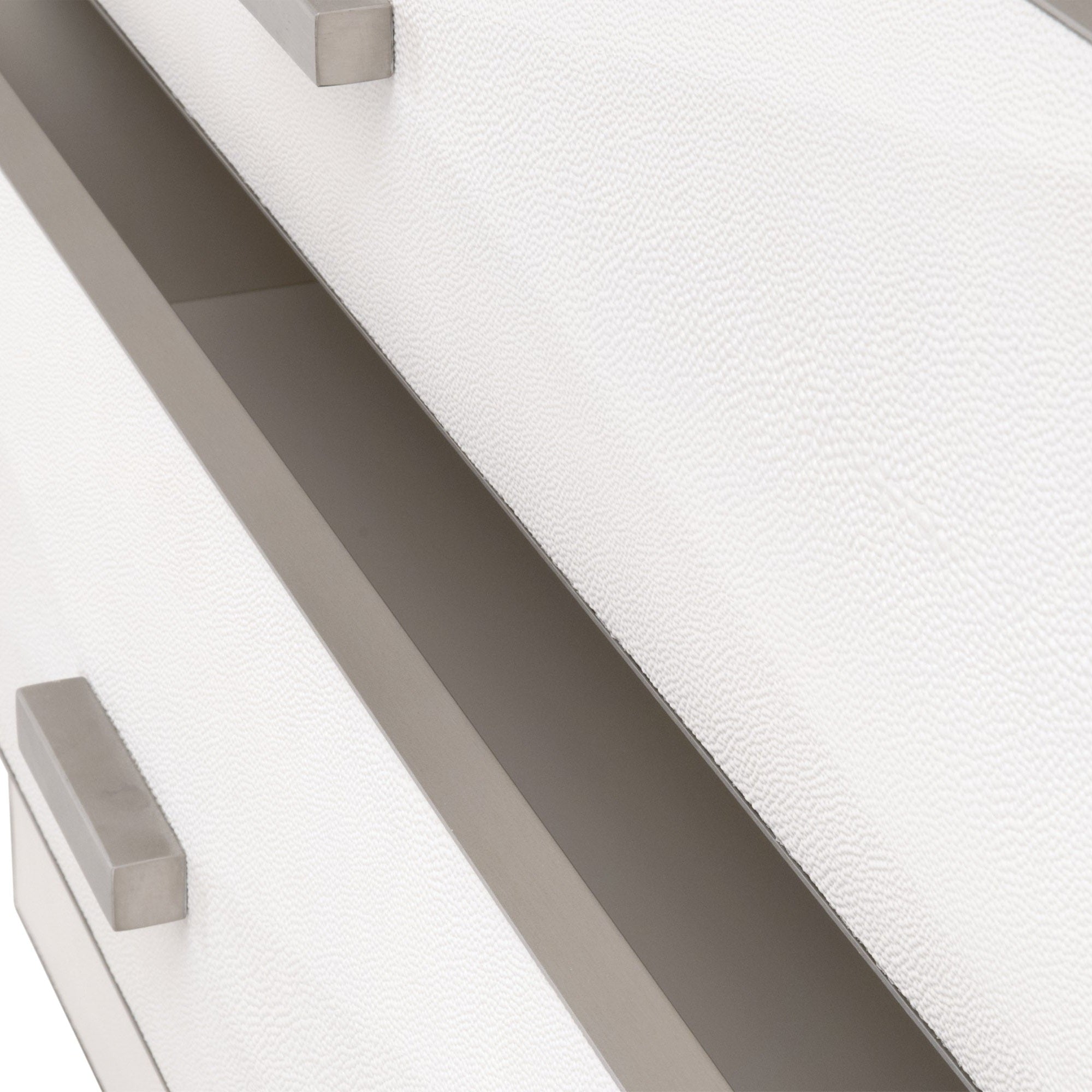 Close-up of pearl-white faux shagreen texture and brushed stainless steel handles on Wynn Shagreen 3-drawer nightstand by Essentials For Living