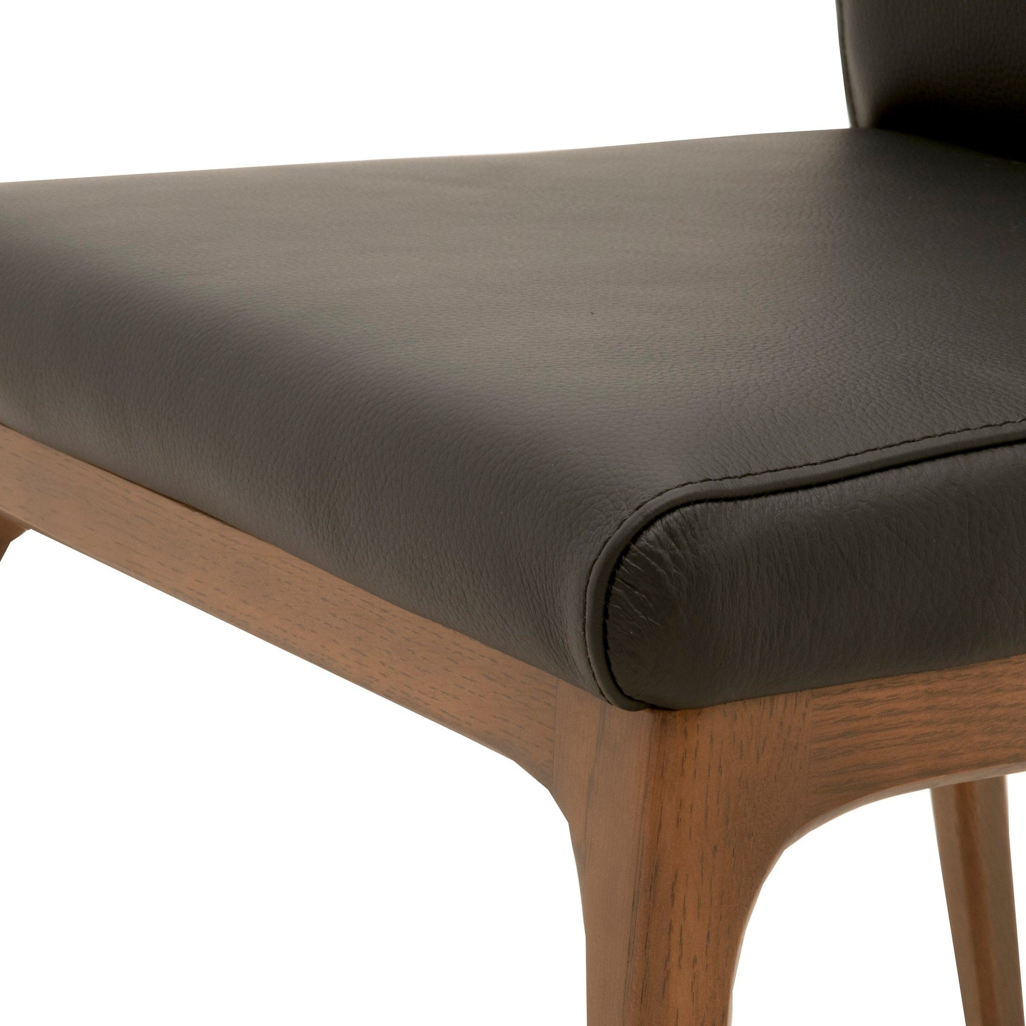 Close-up of Alex Dining Chair, Set of 2 with sable leather seat and walnut oak base by Essentials for Living