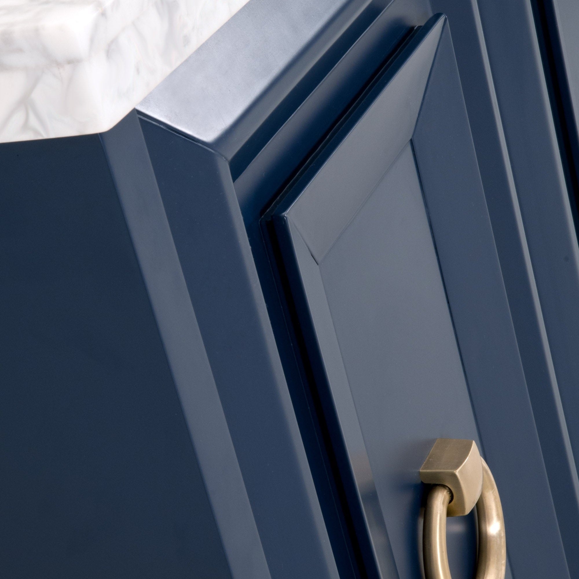 Close-up of navy lacquered door with brushed gold ring pull on Azure Carrera Media Sideboard by Essentials for Living