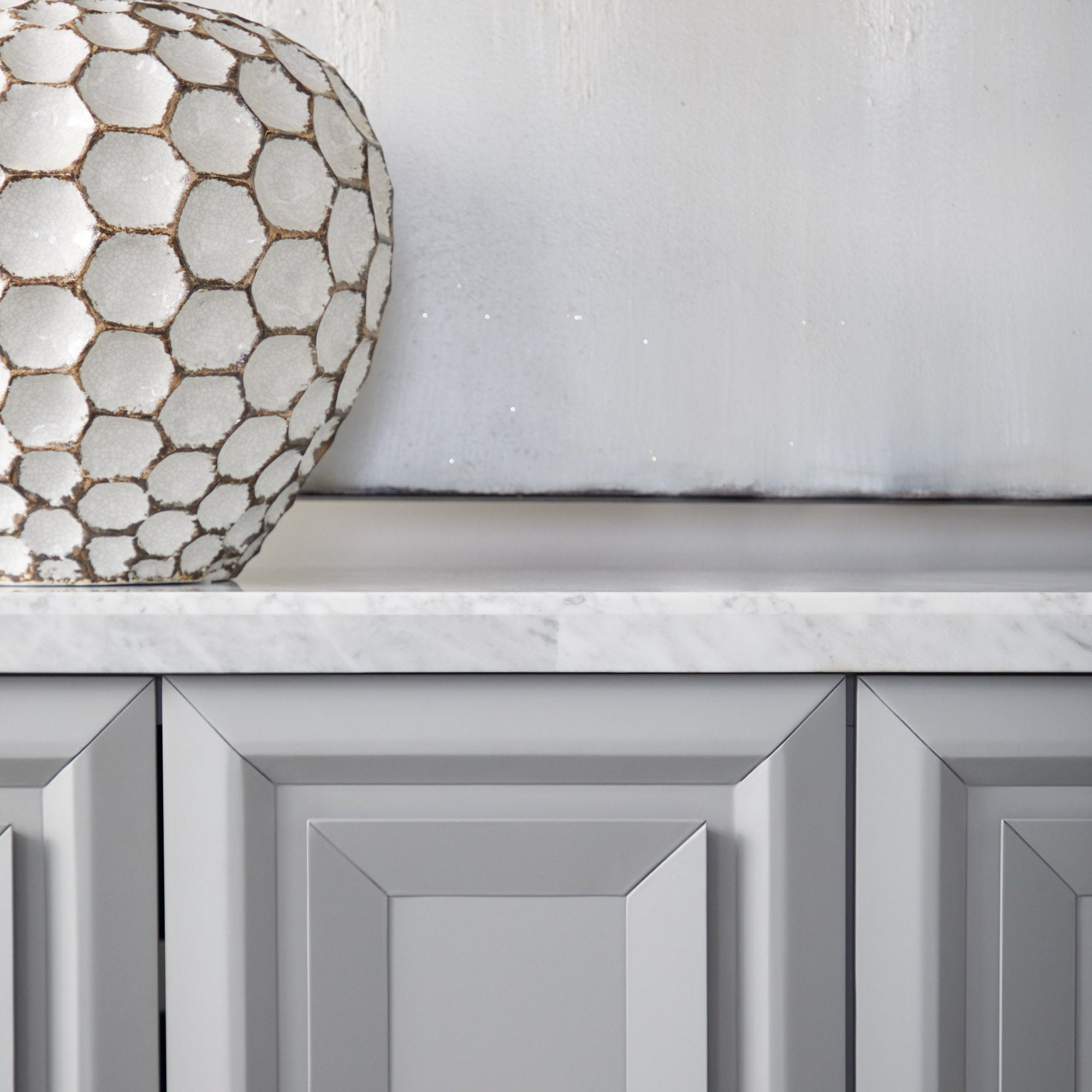 Close-up of Azure Carrera Media Sideboard with Italian Carrera marble top and navy lacquer finish by Essentials for Living