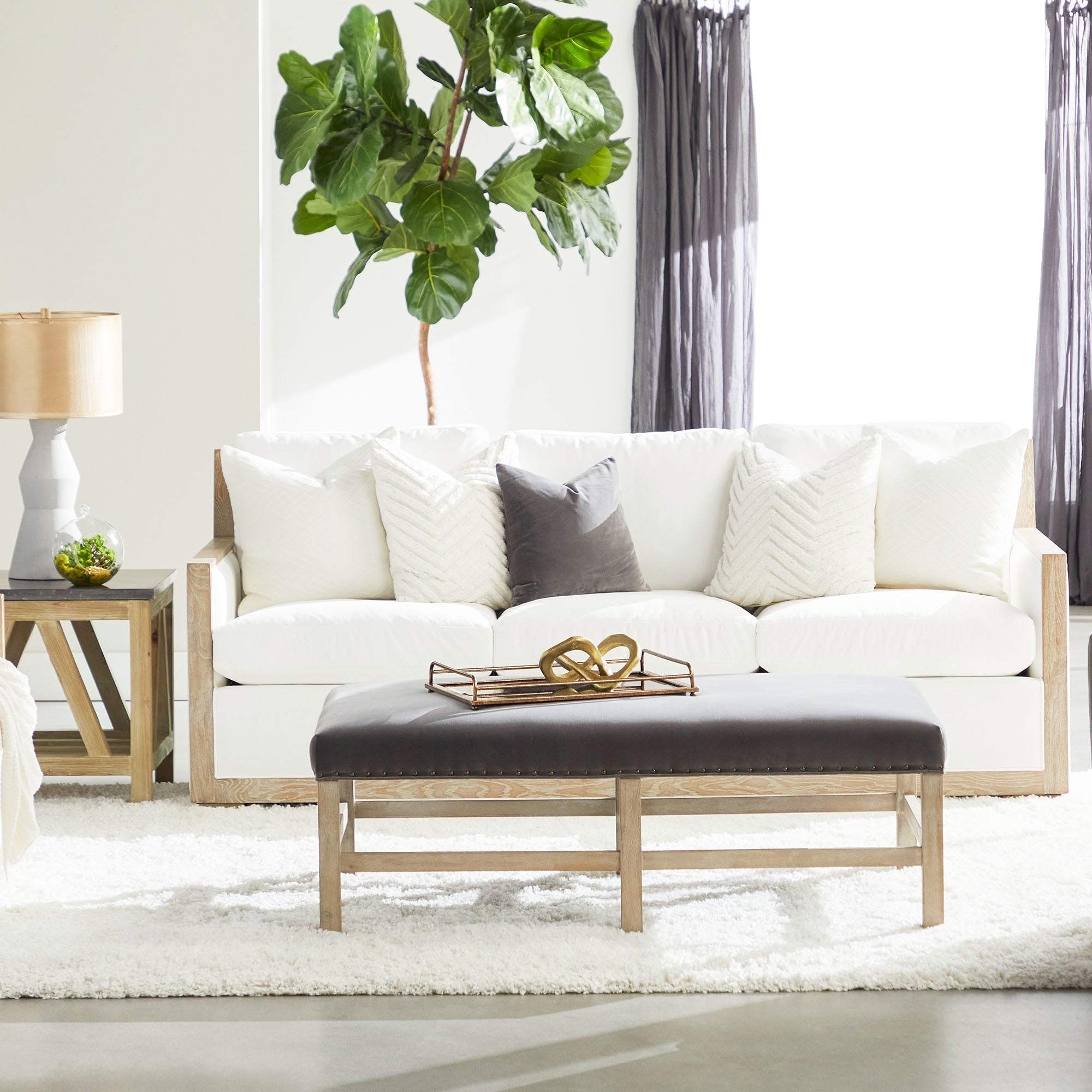 Full-length Bevel Mirror with natural gray acacia veneer frame in a bright living room by Essentials for Living.
