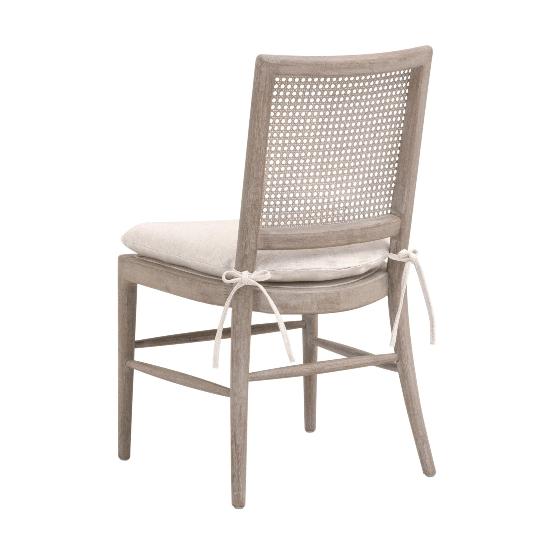 Blume Dining Chair with handwoven cane back, cream linen cushion tied to natural gray oak frame by Essentials for Living