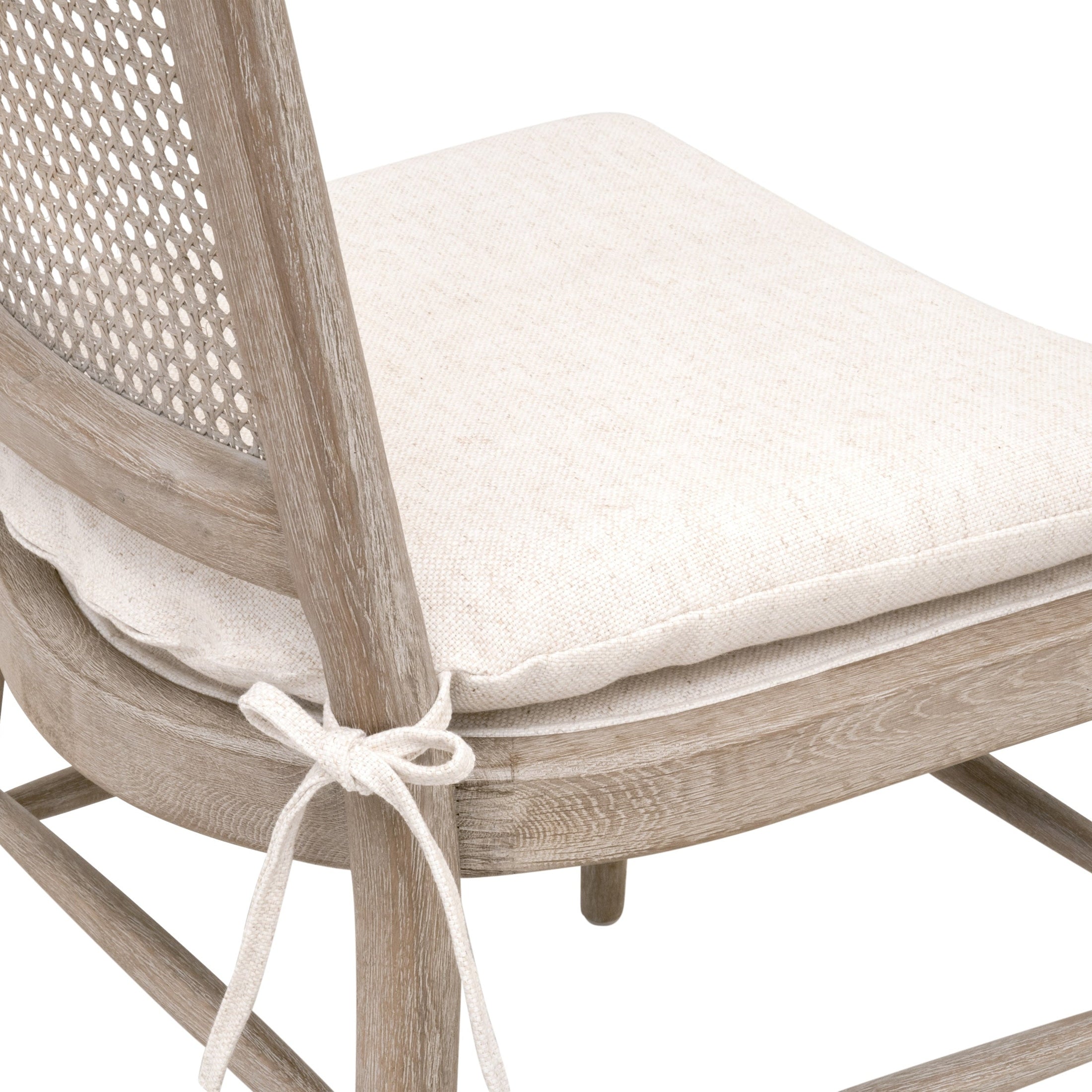Close-up of Blume Dining Chair set of 2 with cream linen cushion and cane back by Essentials for Living