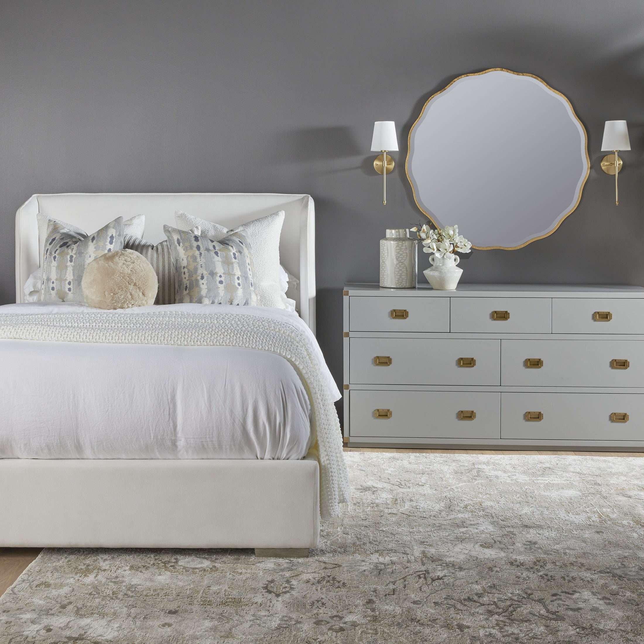 Bradley 7-Drawer Double Dresser in dove gray lacquer with brushed gold hardware beside bed Essentials for Living
