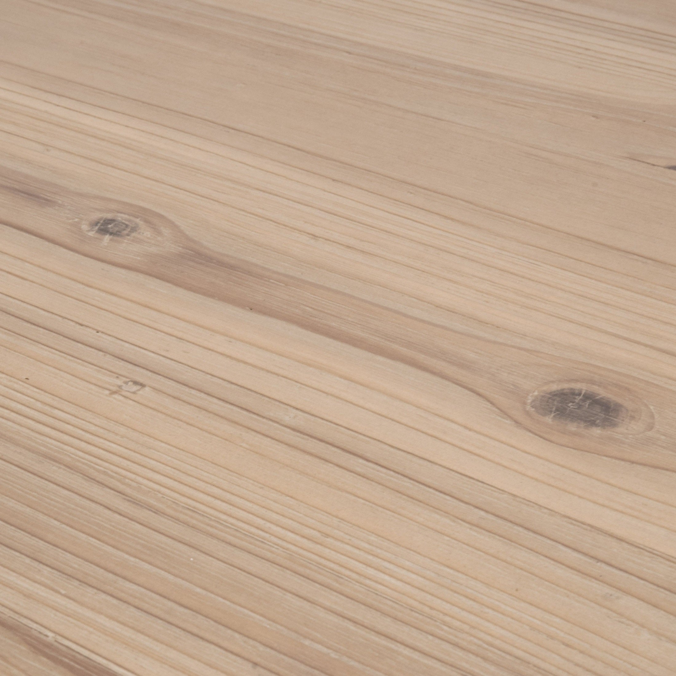 Close-up of smoke gray reclaimed pine plank veneer tabletop of Bridge Dining Table by Essentials For Living