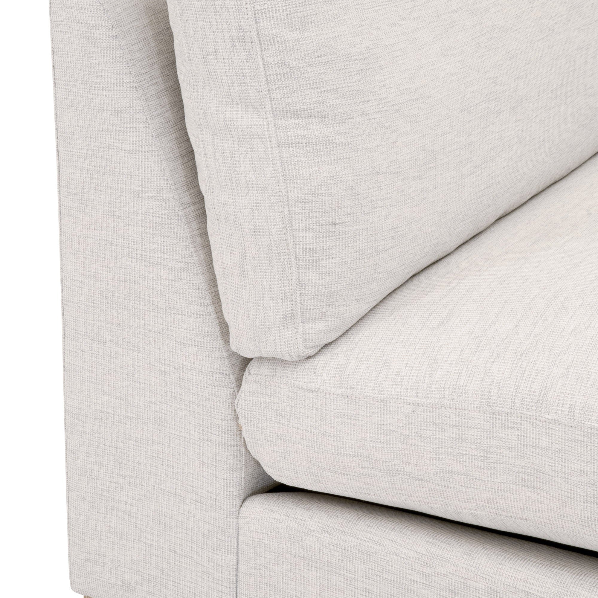 Close-up of light gray and white woven fabric on Essentials For Living Clara Modular 1-Seat Armless Chair cushion and frame