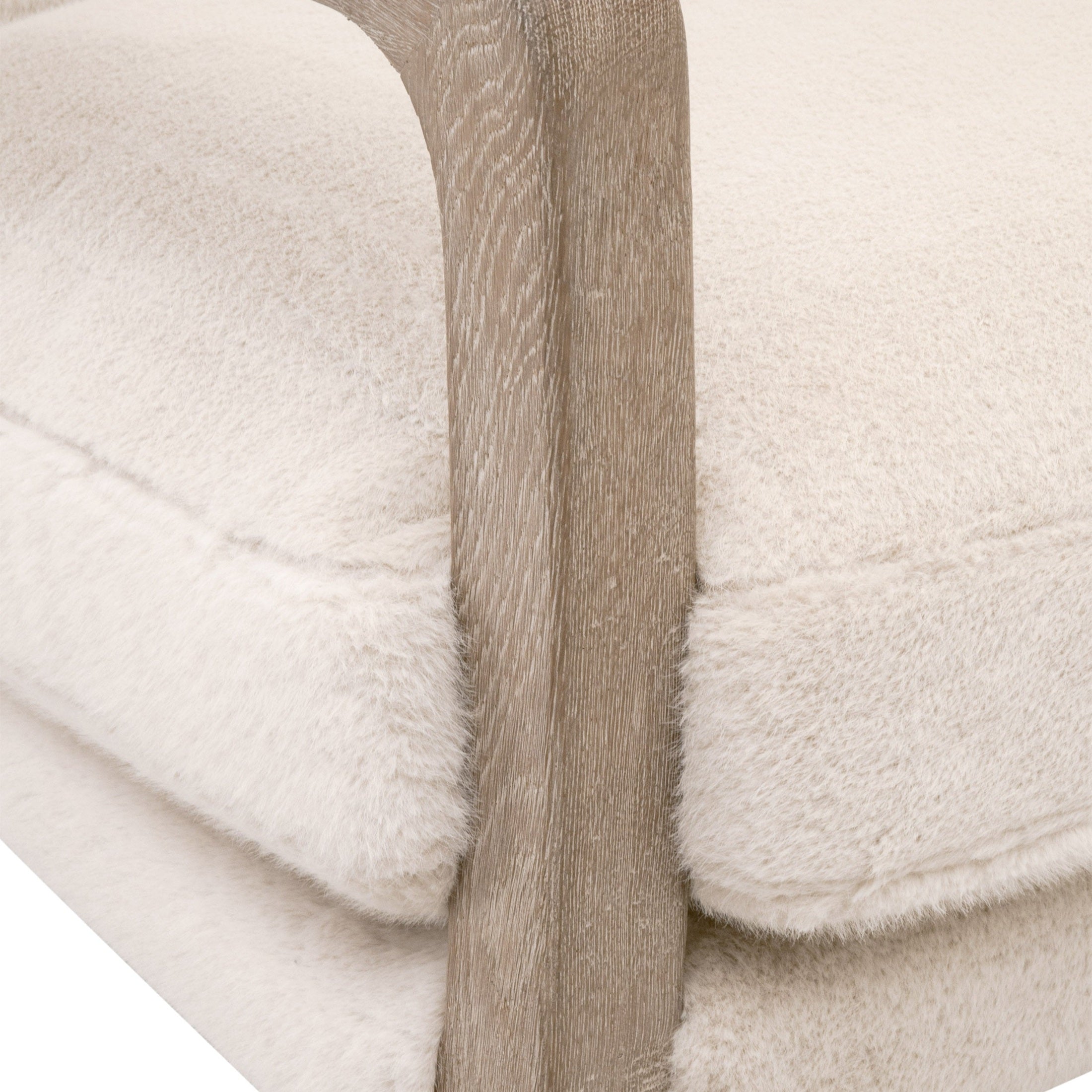 Close-up of light wood arm and plush cushion on Calvin Club Chair by Essentials For Living