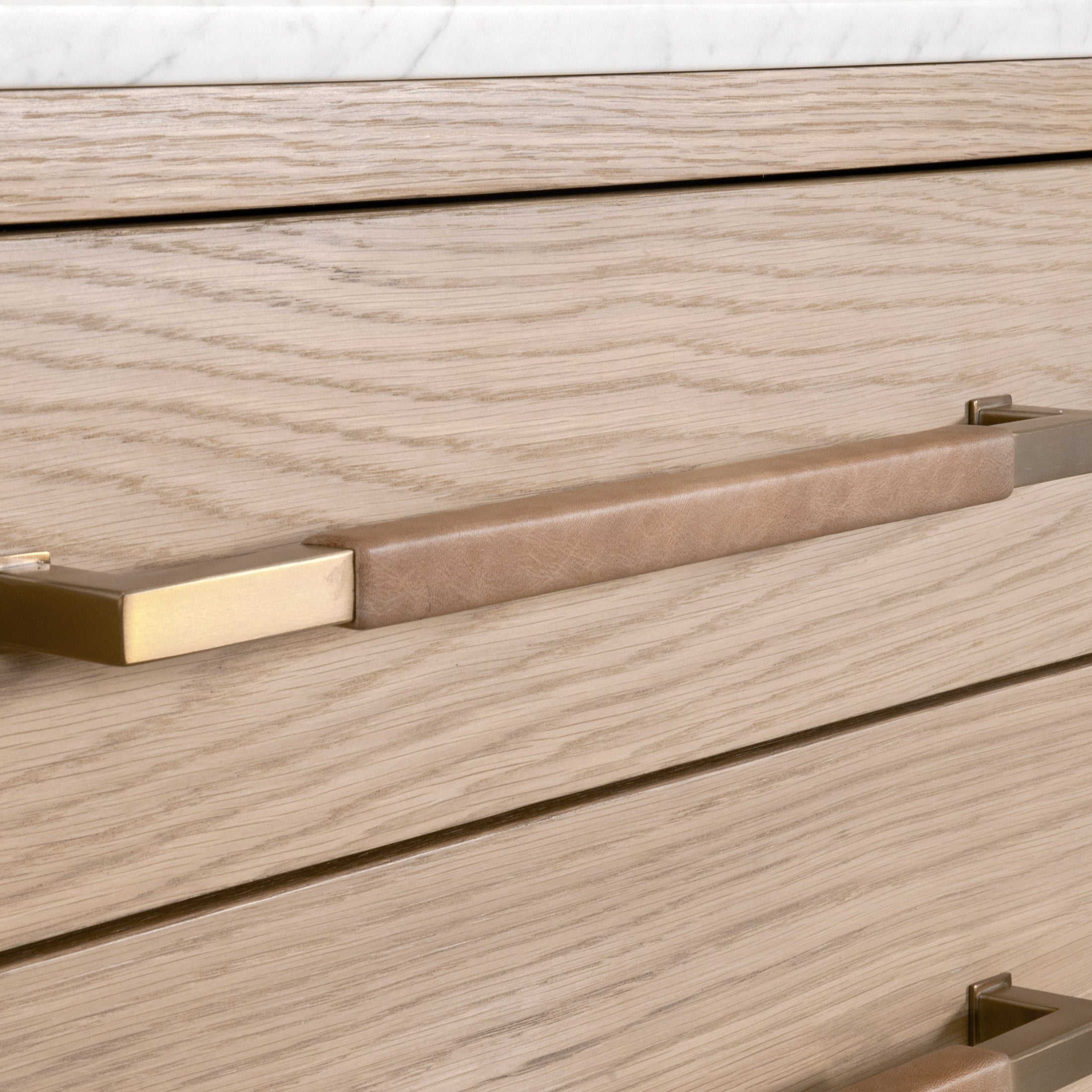 Close-up of aged brass drawer pull on Dutch brown oak Cambria 8-Drawer Double Dresser by Essentials for Living