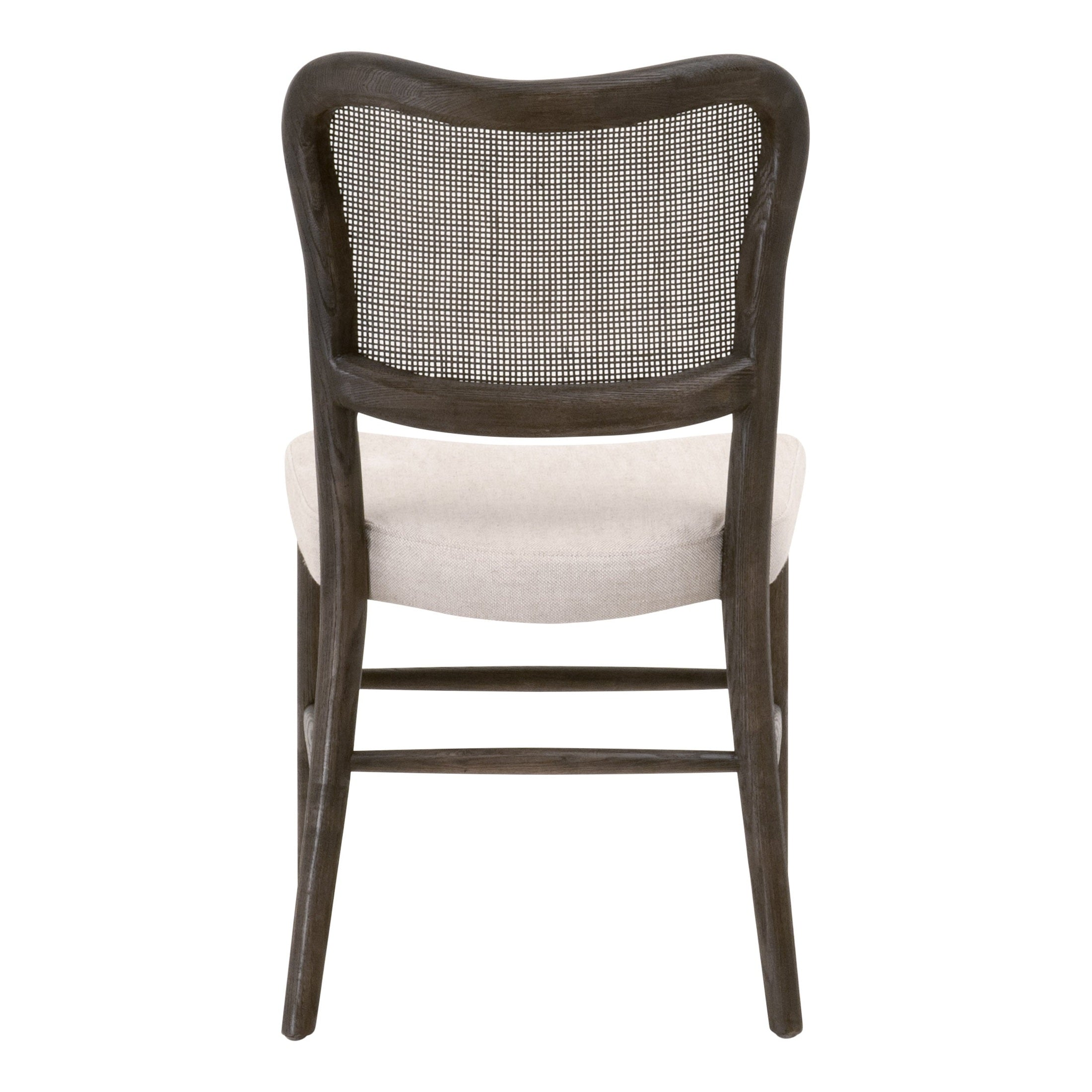 Back view of Cela Dining Chair by Essentials For Living with handwoven cane back and bisque upholstered seat