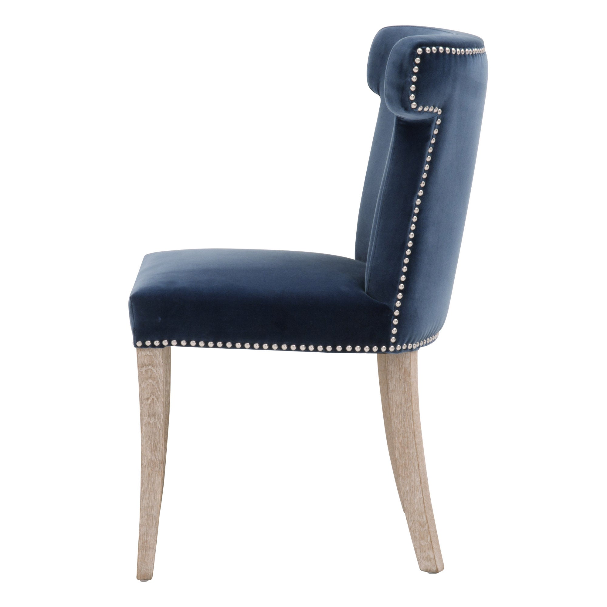 Side view of Celina Dining Chair in denim velvet with silver nailhead trim and natural gray oak legs by Essentials for Living