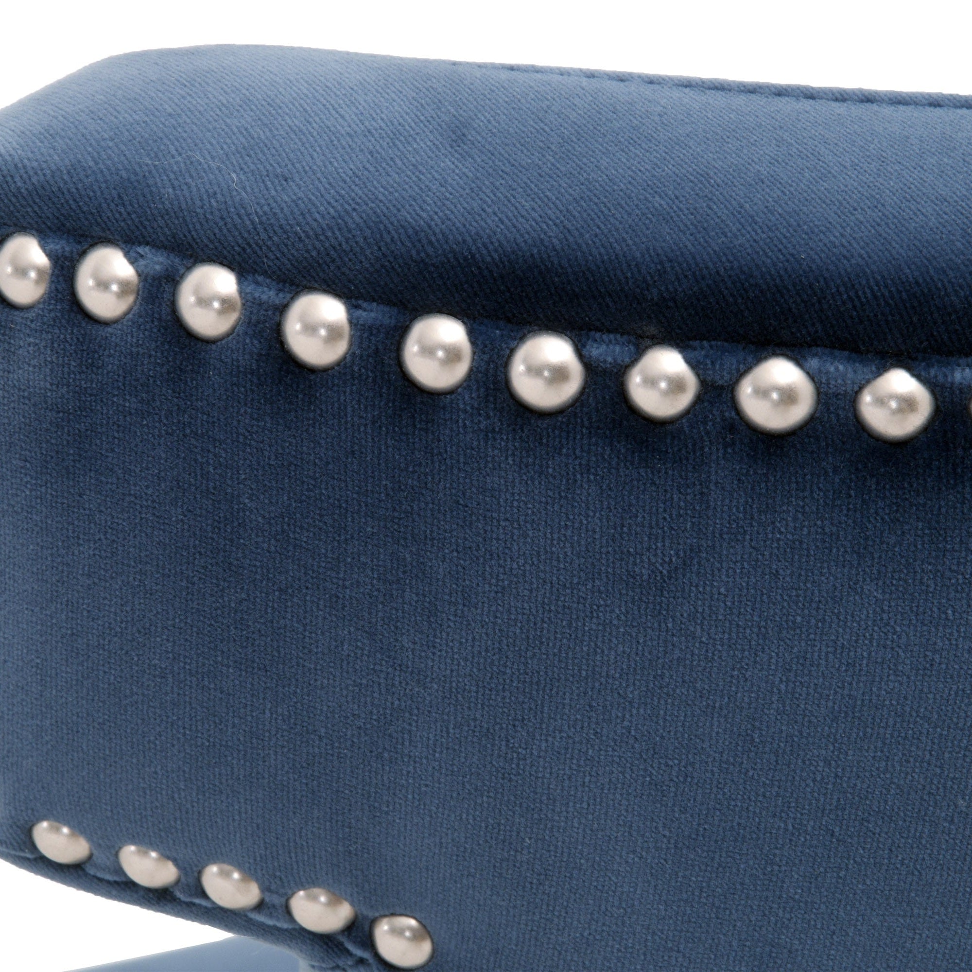Close-up of denim blue velvet upholstery with brushed silver nailhead trim on the Celina Dining Chair by Essentials for Living