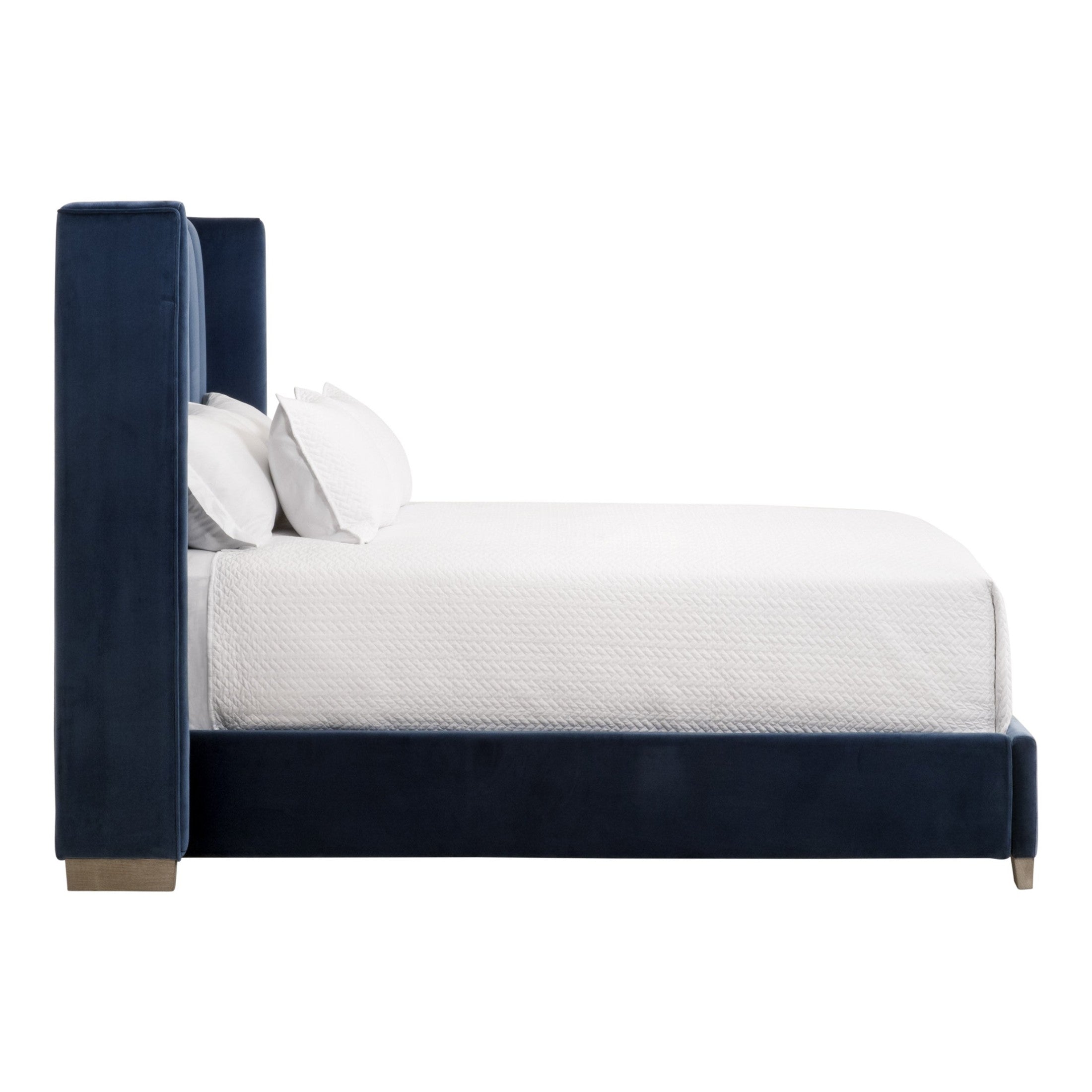 Side view of navy velvet Chandler Queen Bed with tall wingback headboard and solid wood feet by Essentials for Living