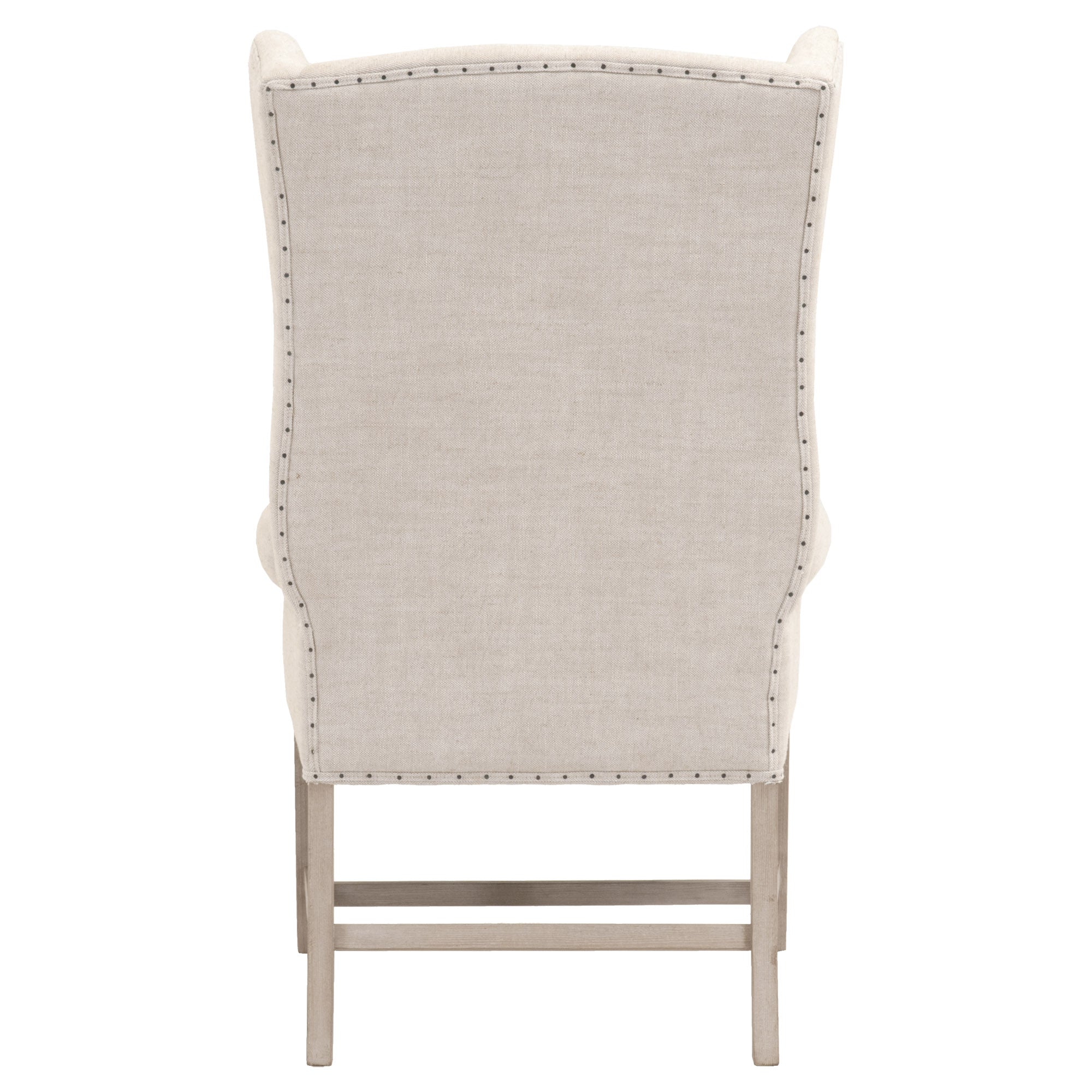 Back view of Essentials For Living Chateau Arm Chair in bisque linen with nail tack trim and natural gray wood frame