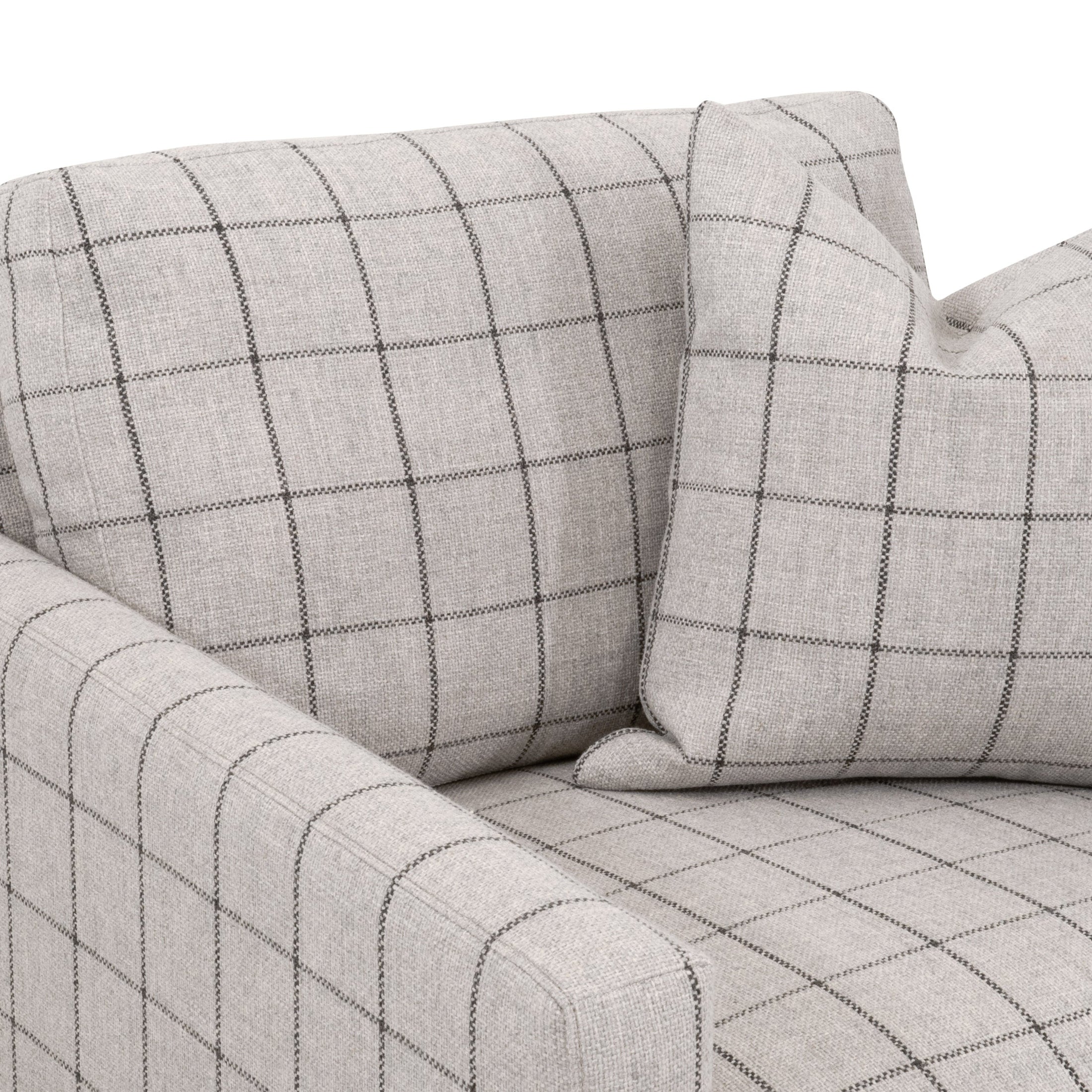 Close-up of light gray plaid slim arm sofa chair with matching cushion and soft fabric texture