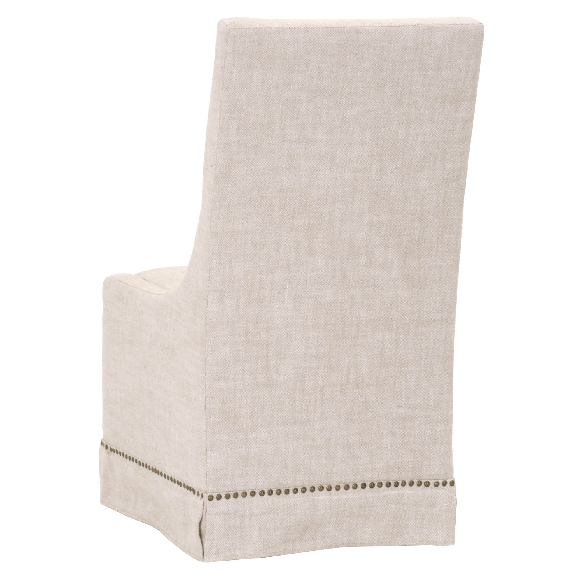 Essentials For Living Colleen Dining Chair in creamy bisque linen with gold nail head trim and fitted skirt bottom rear view