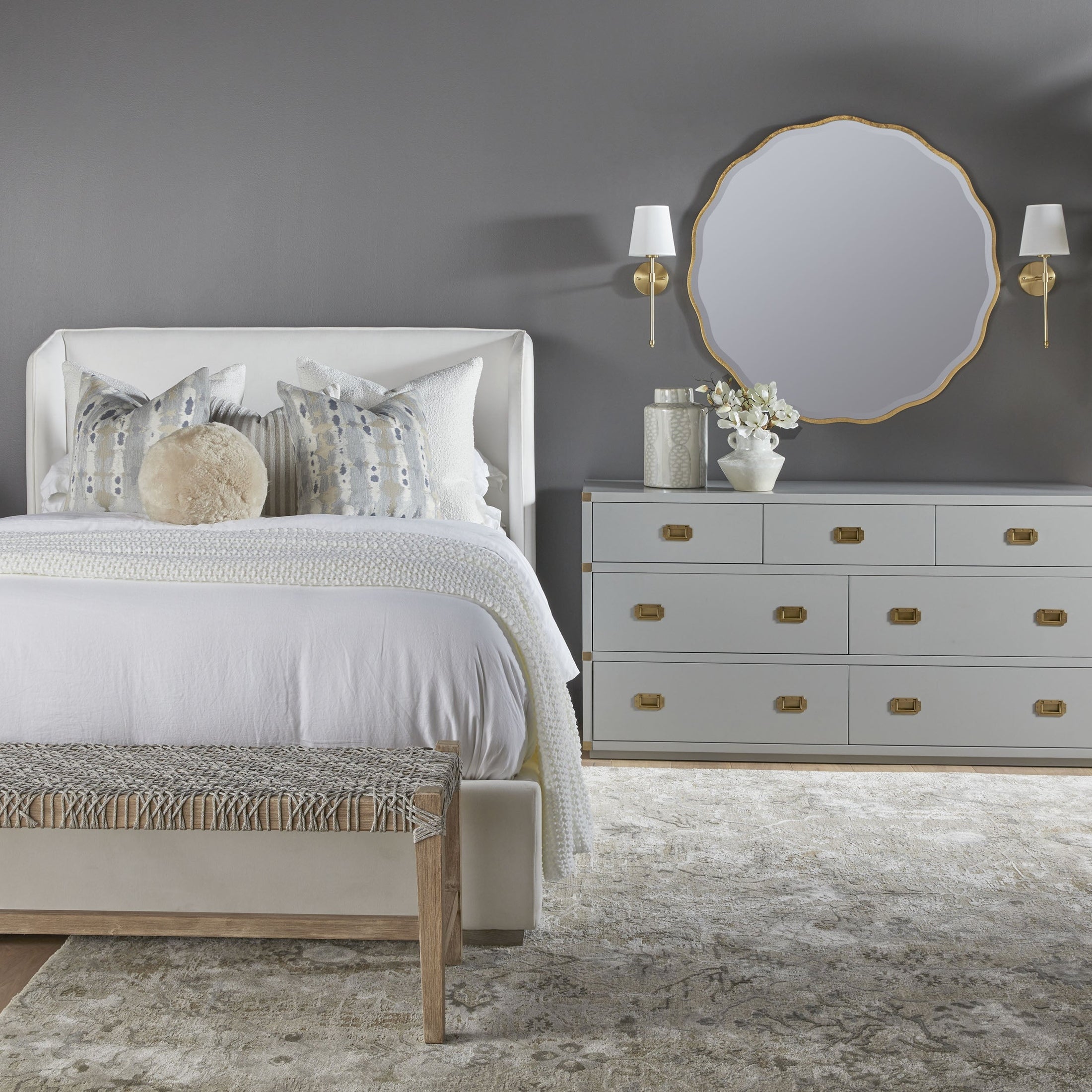 Elegant Costa Bench with woven white and taupe polypropylene seat on solid mahogany base in stylish bedroom setting