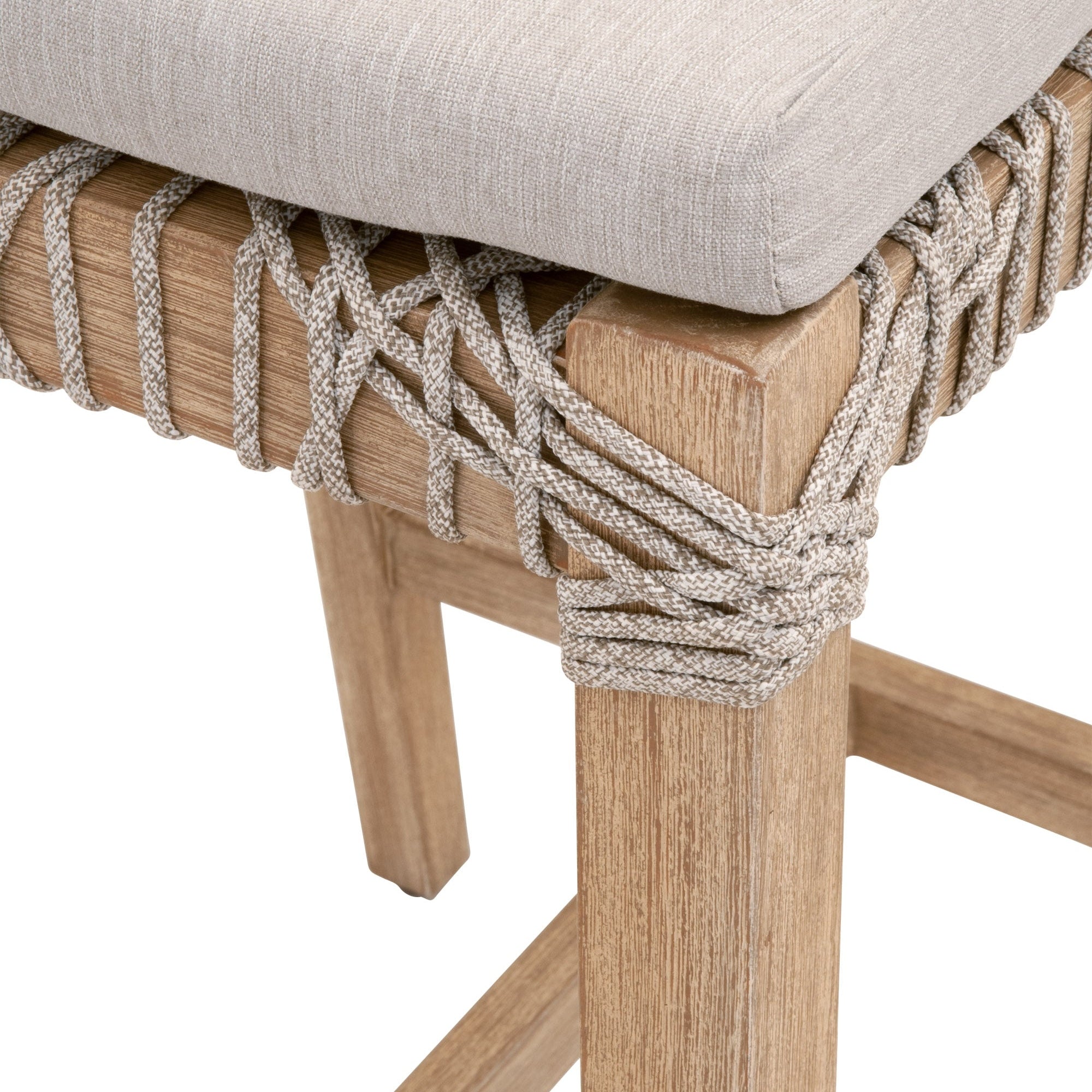 Close-up of Costa Counter Stool corner showing woven taupe polypropylene rope on natural gray mahogany wood frame with beige cushion