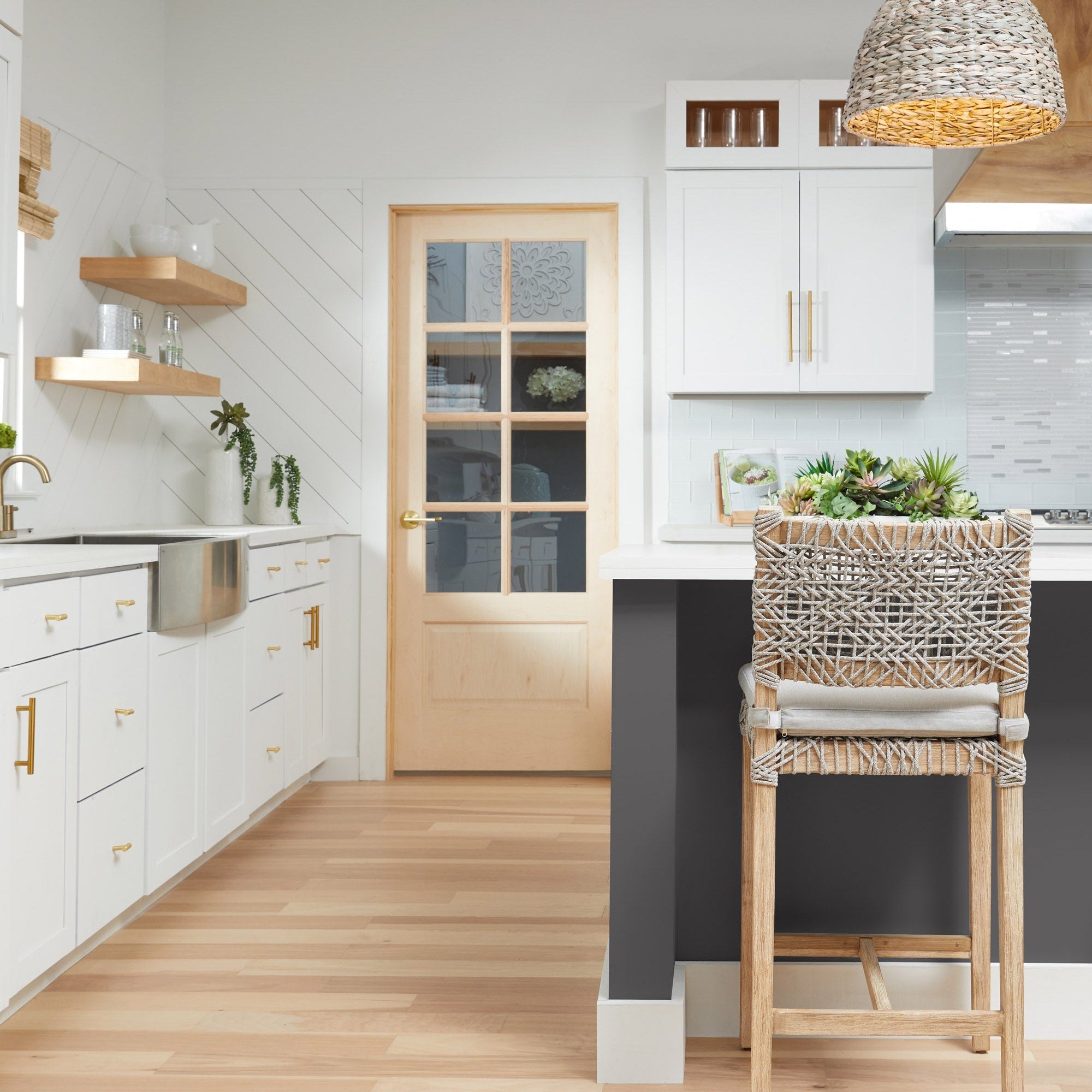 Essentials For Living Costa Counter Stool with white and taupe woven polypropylene in a bright kitchen setting