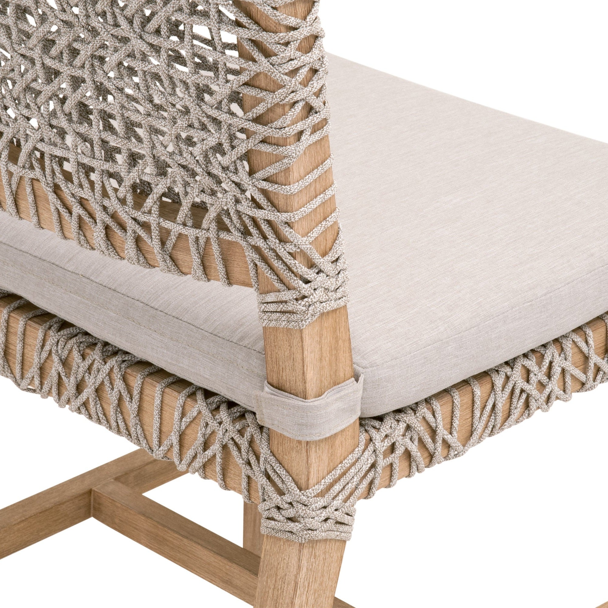 Close-up of Essentials For Living Costa Dining Chair with woven taupe polypropylene rope and pumice fabric cushion on wood frame