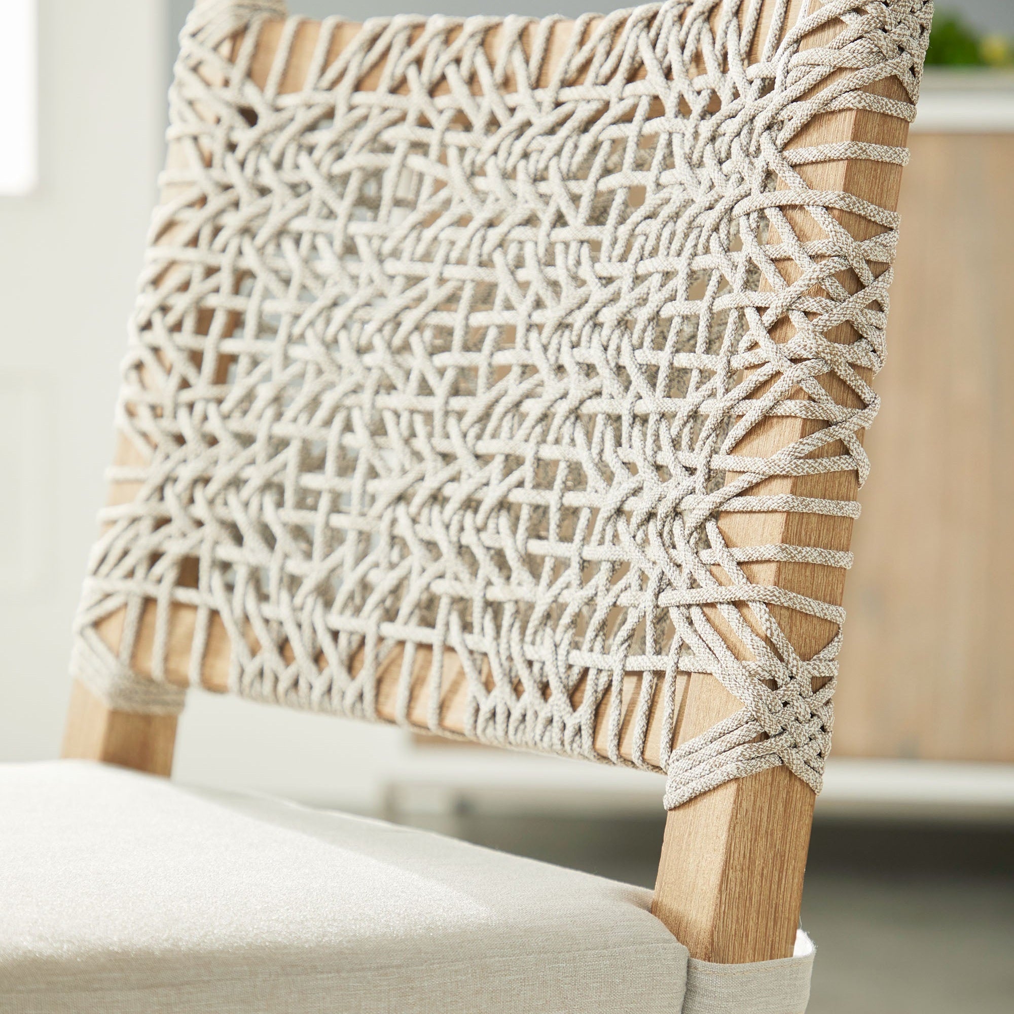 Close-up of Essentials for Living Costa Dining Chair back with white and taupe woven polypropylene rope and wood frame detail